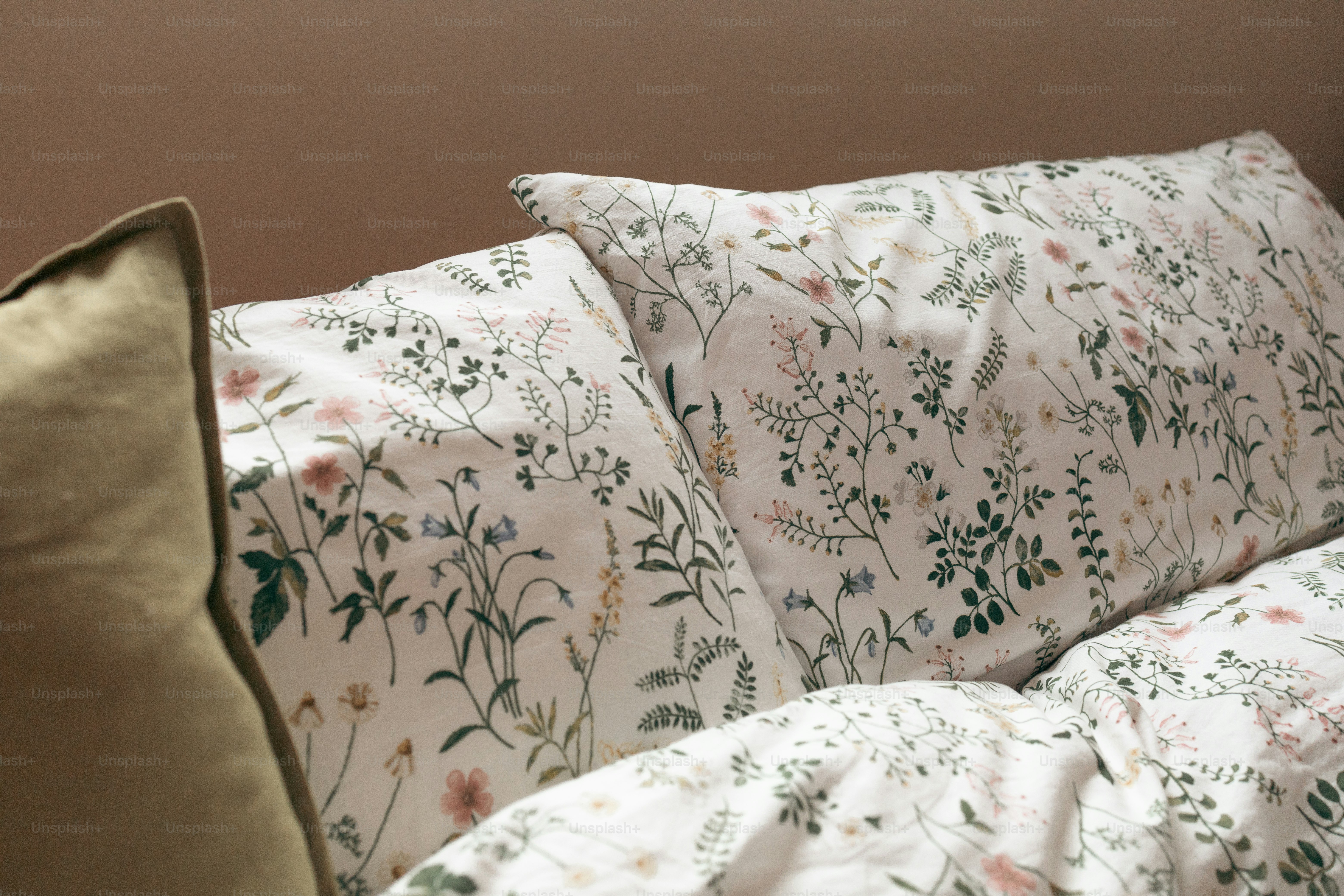 a close up of a pillow on a bed