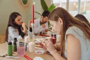 a group of people sitting around a table