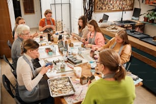 a group of people sitting around a table