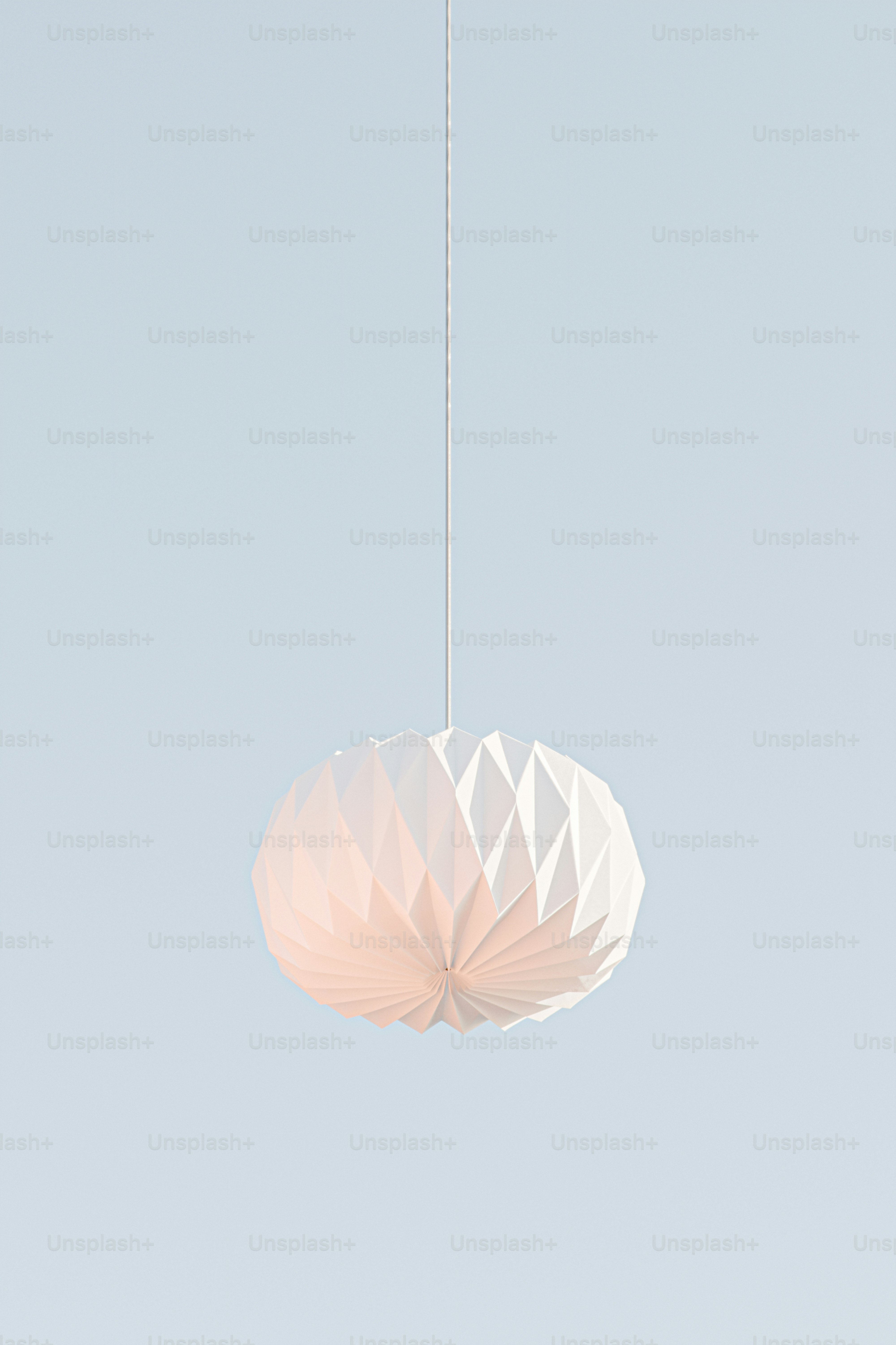 a white light fixture hanging from a ceiling