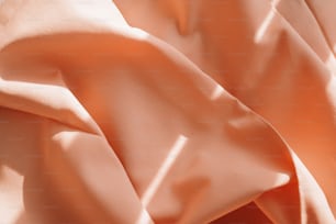 um close up de um tecido cor de pêssego