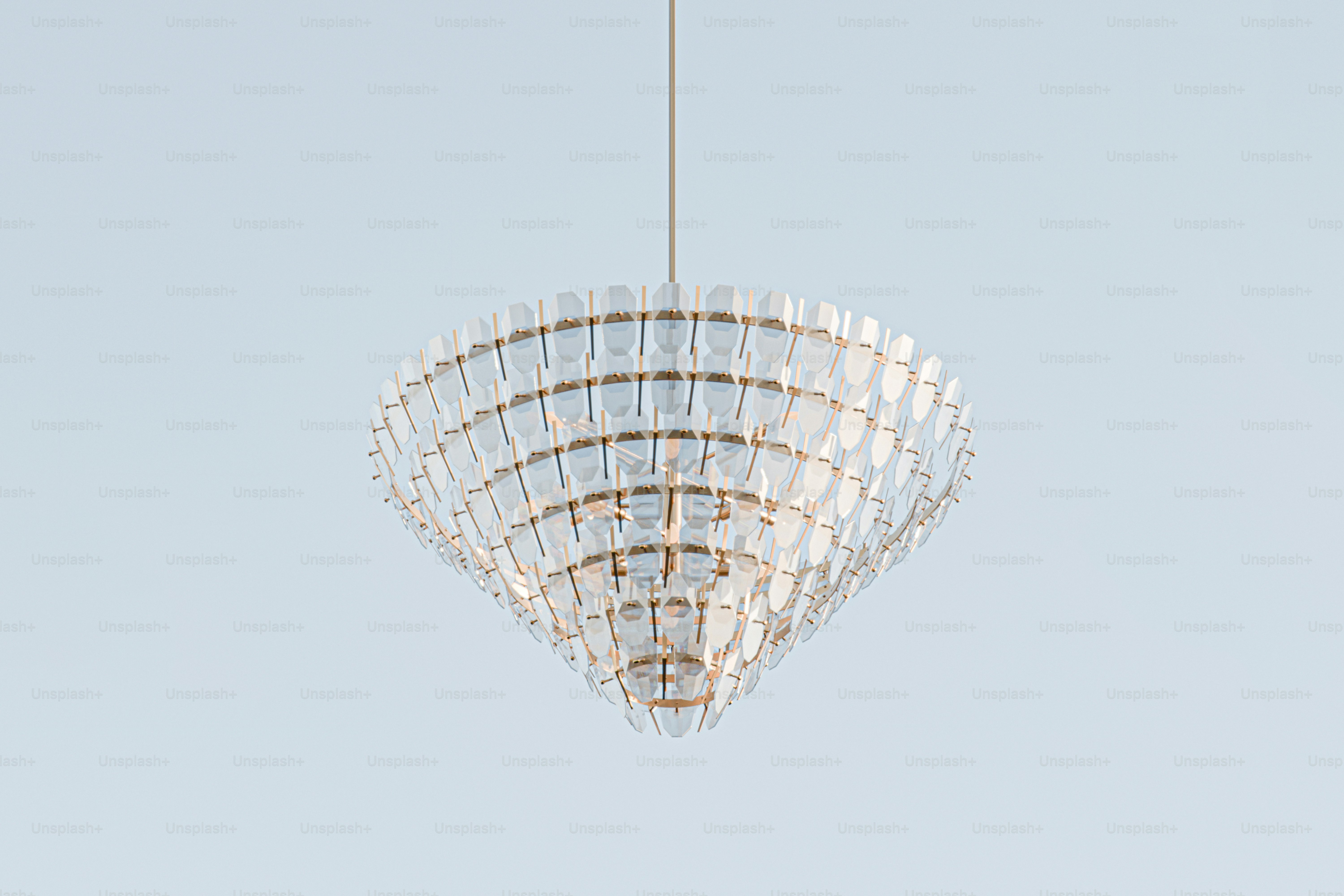 a chandelier hanging from a ceiling in a room