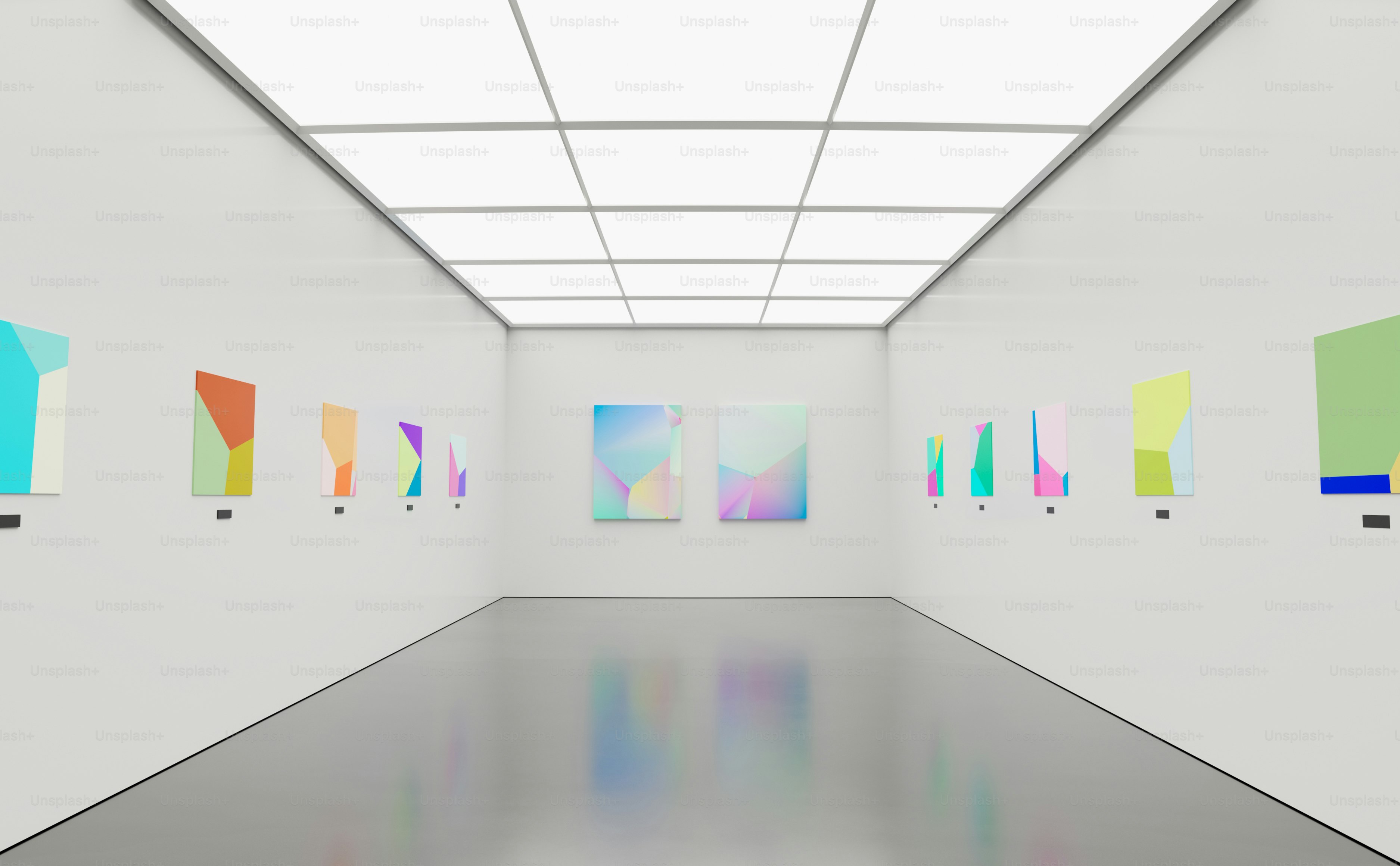 an empty room with paintings on the wall
