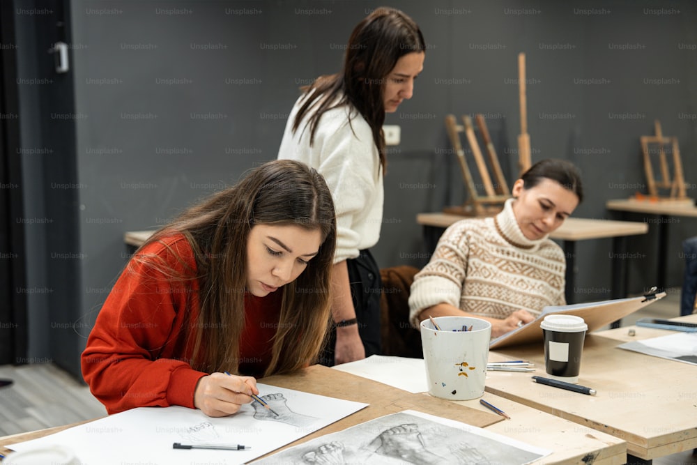 a group of people sitting around a wooden table