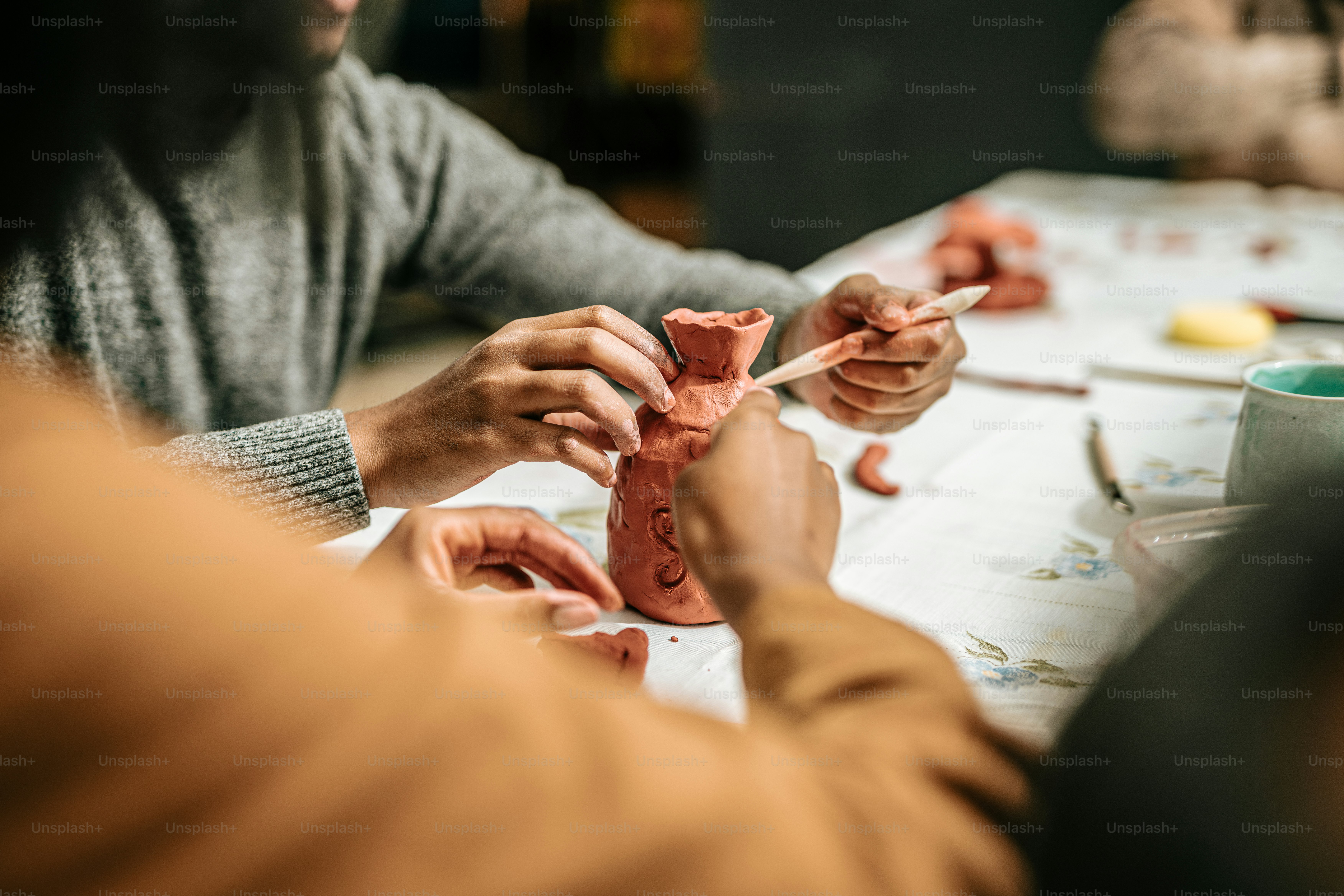 a couple of people that are making clay