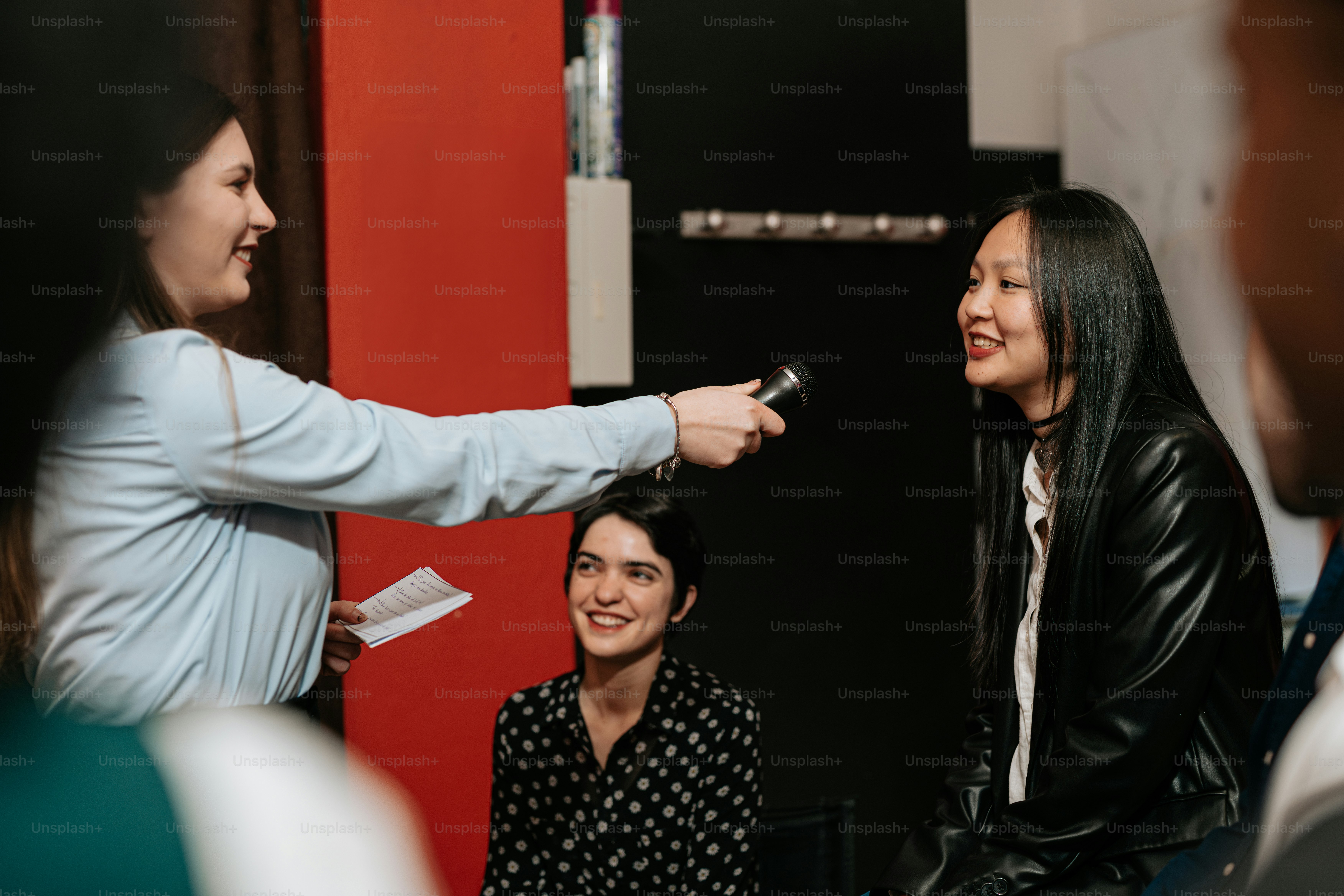 a group of women standing around each other