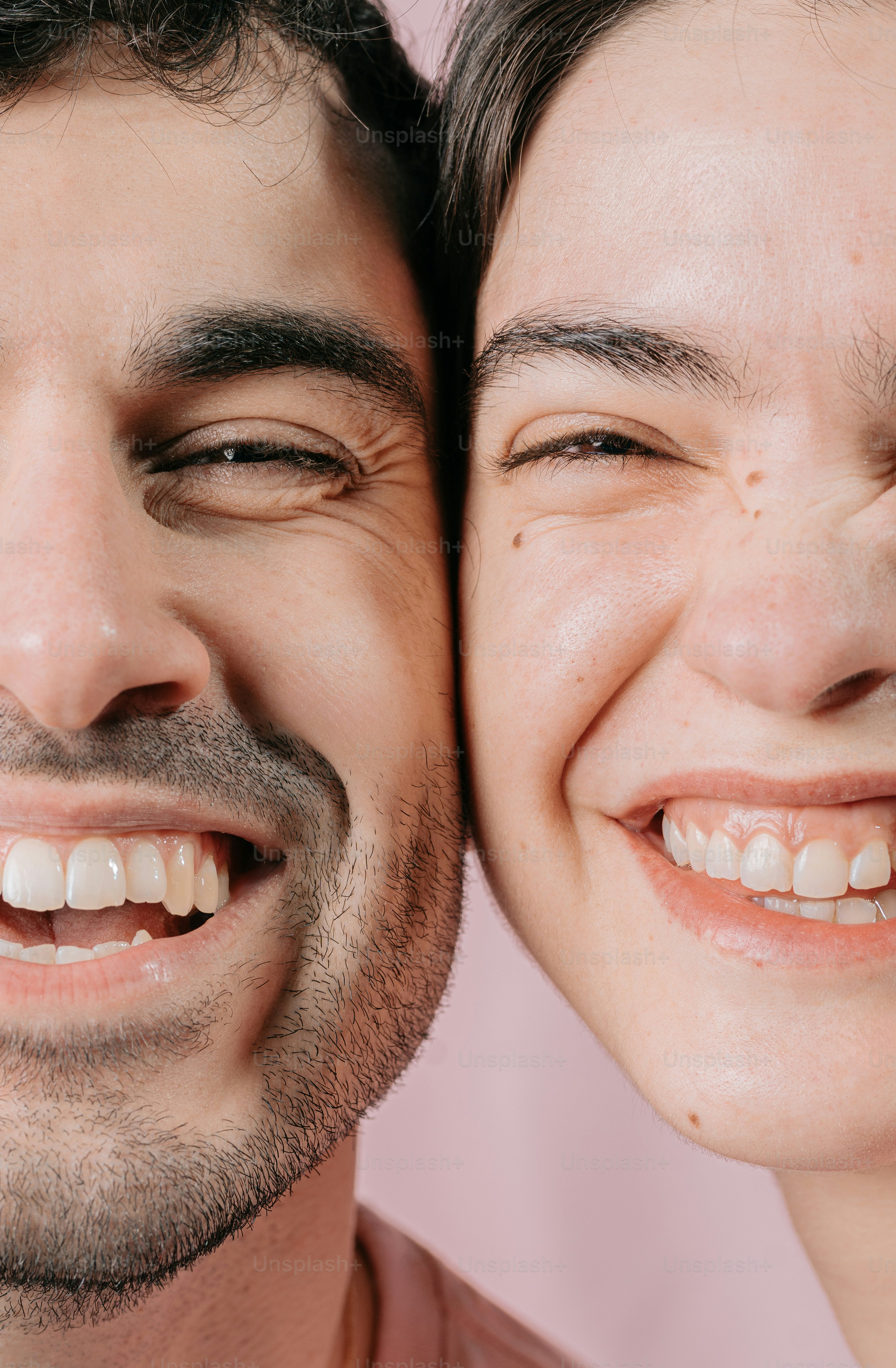 a man and a woman smiling for the camera