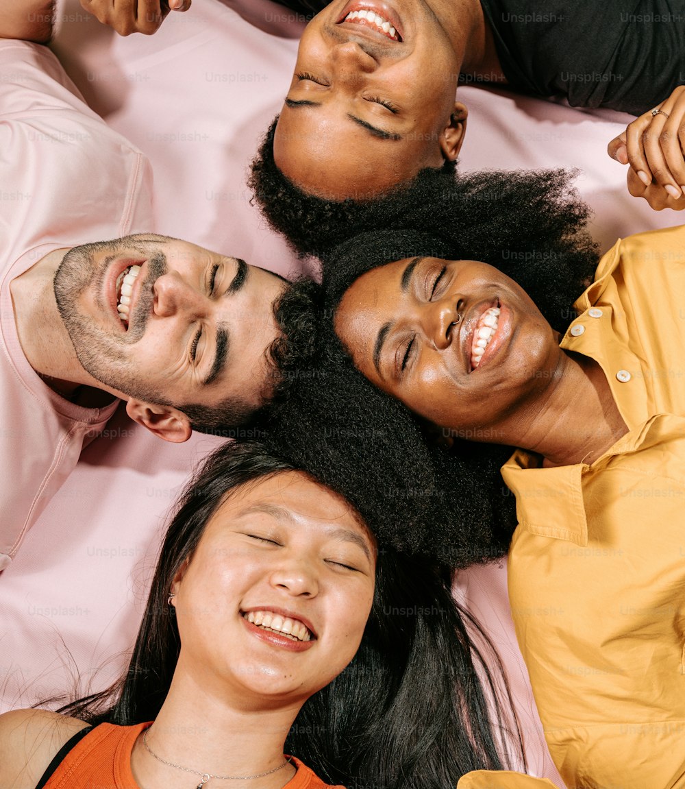 a group of people laying on top of each other