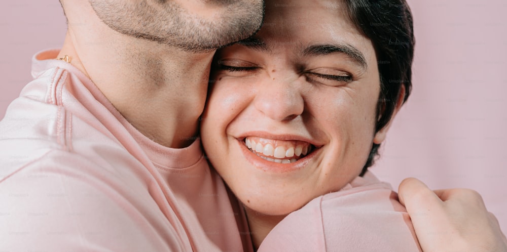a man and a woman hugging each other