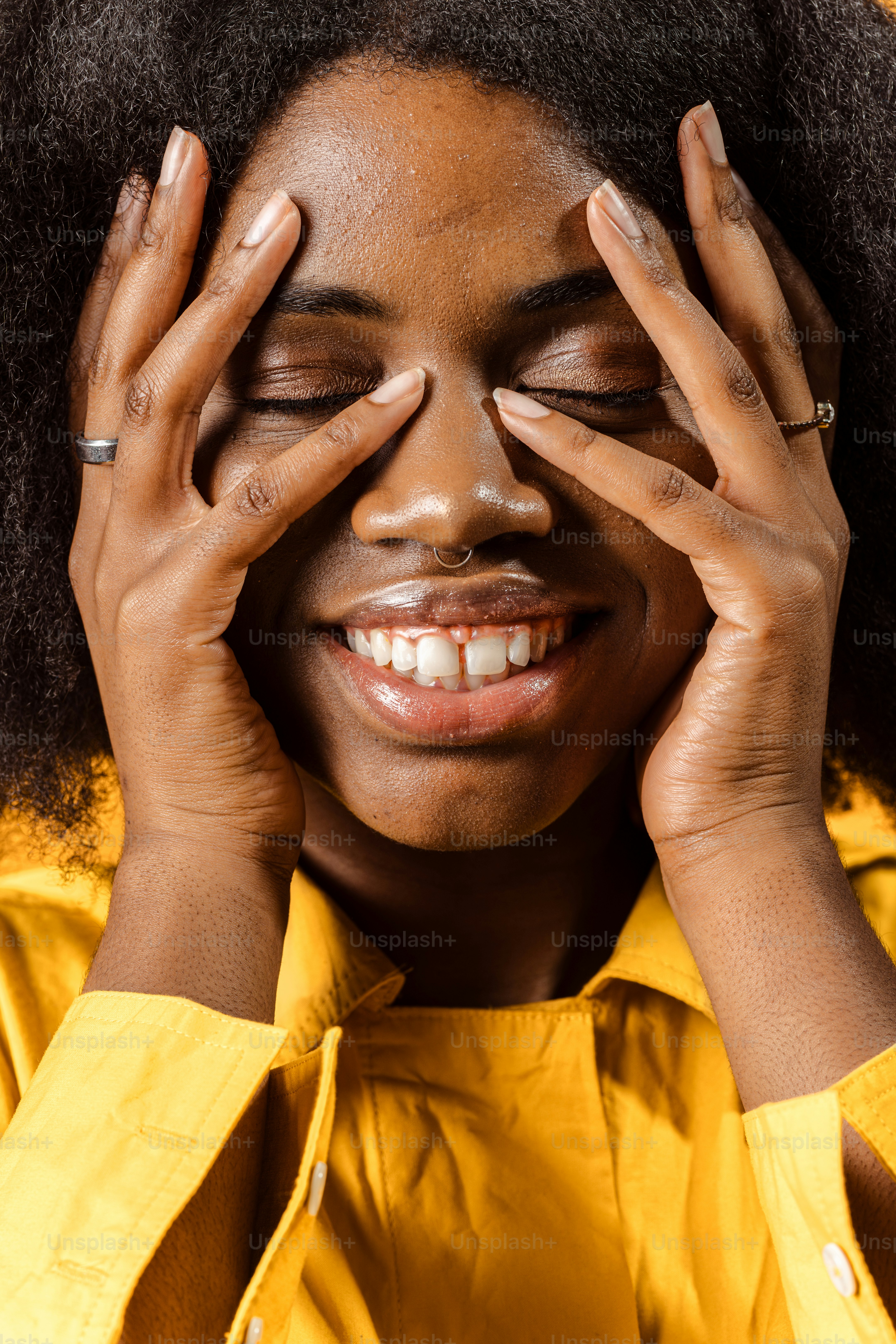 a woman with her hands on her face