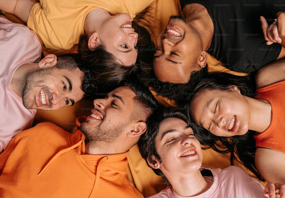 a group of people laying on top of each other