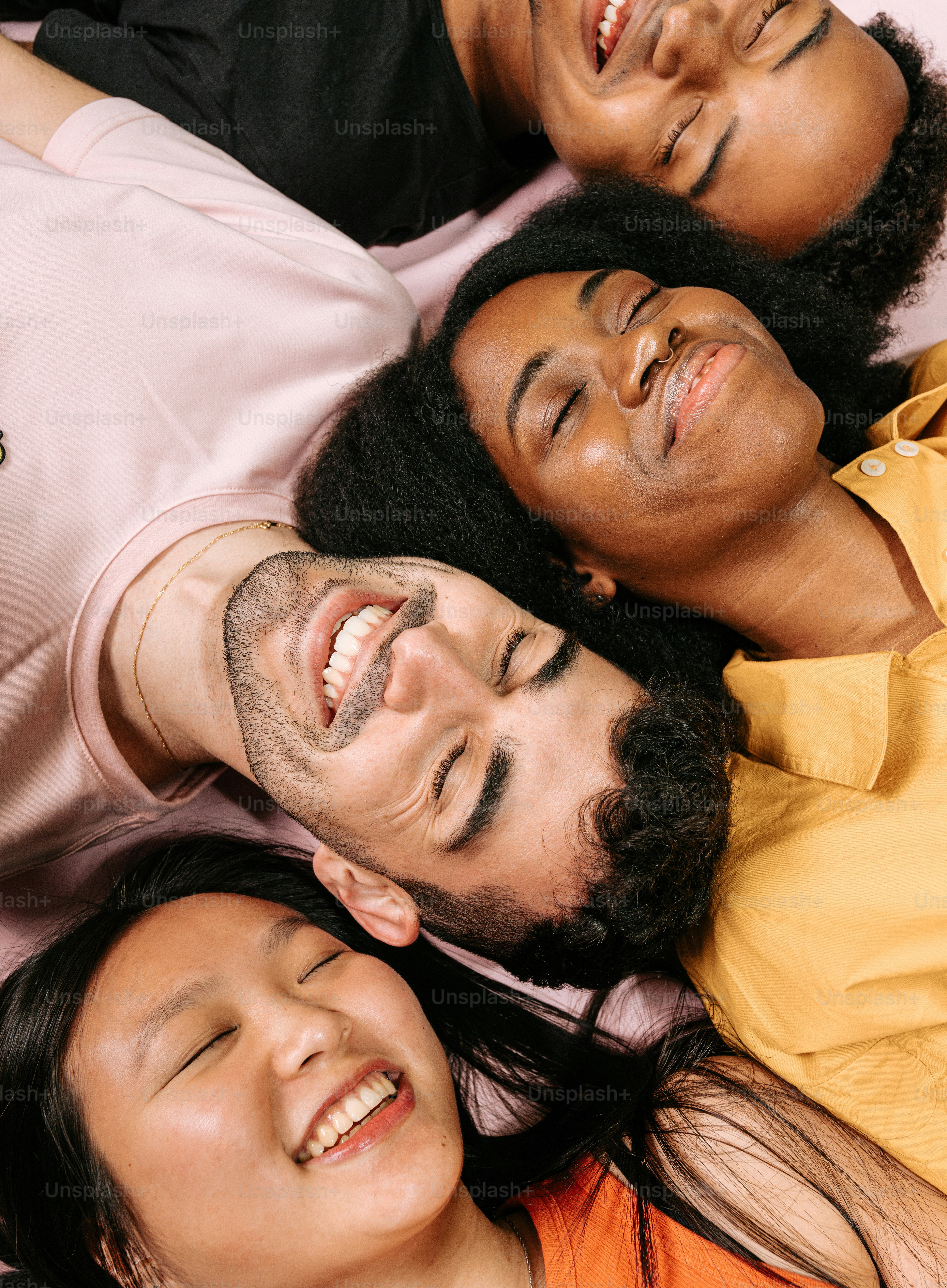 a group of people laying on top of each other