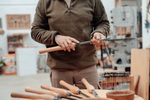 a man holding a pair of scissors in his hands