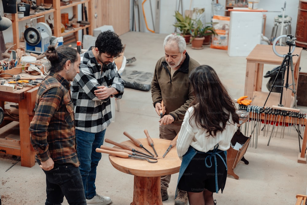 a group of people standing around a wooden table