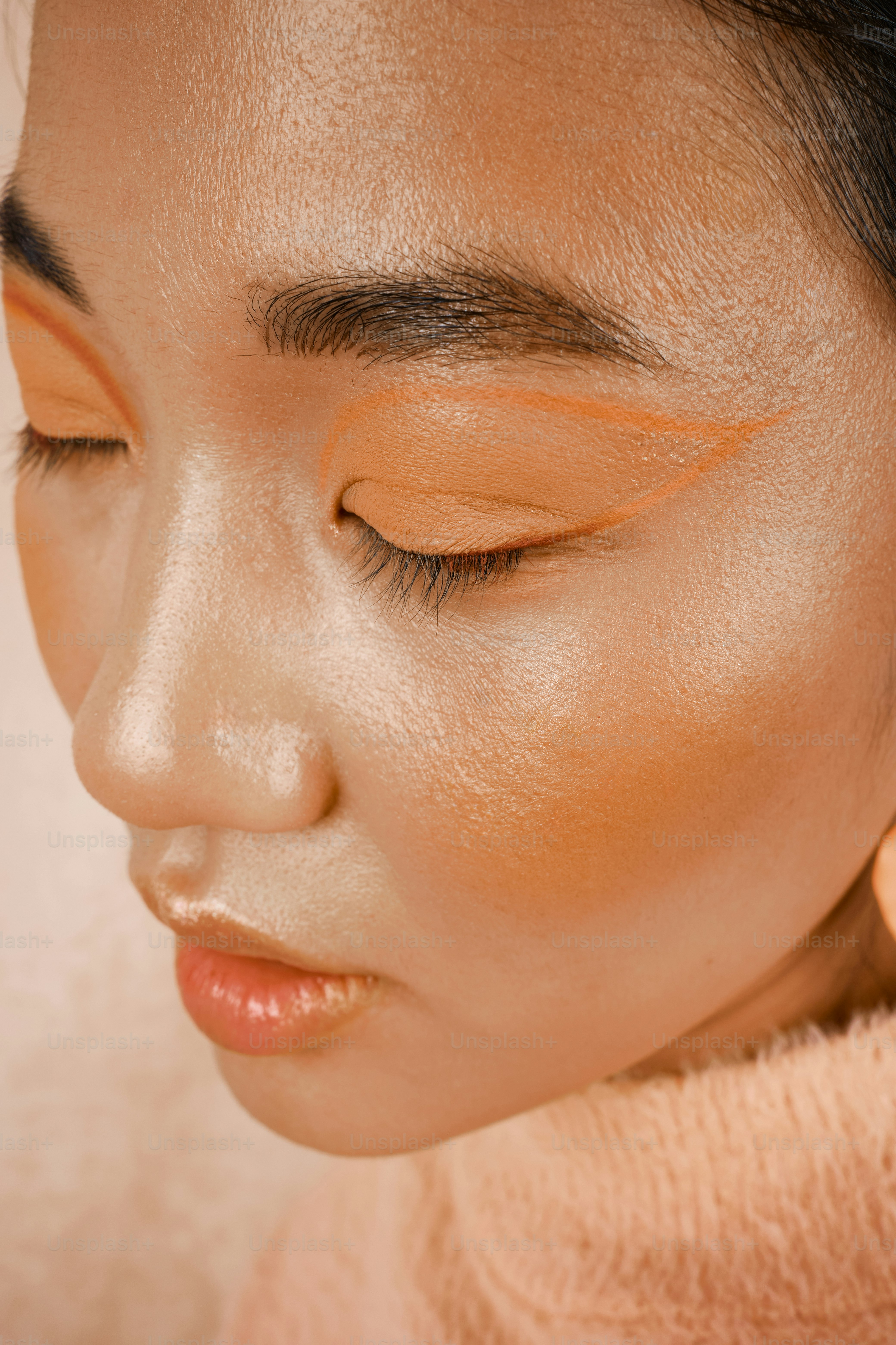 a close up of a woman with her eyes closed