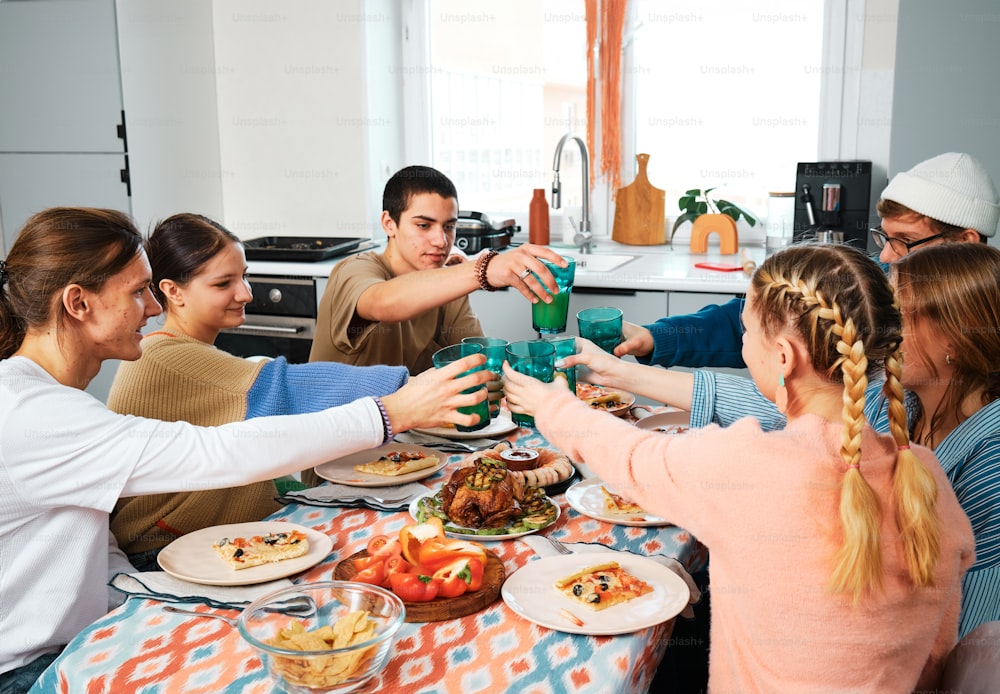 a group of people that are sitting around a table