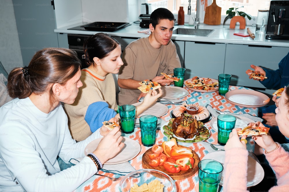 a group of people sitting around a table eating food