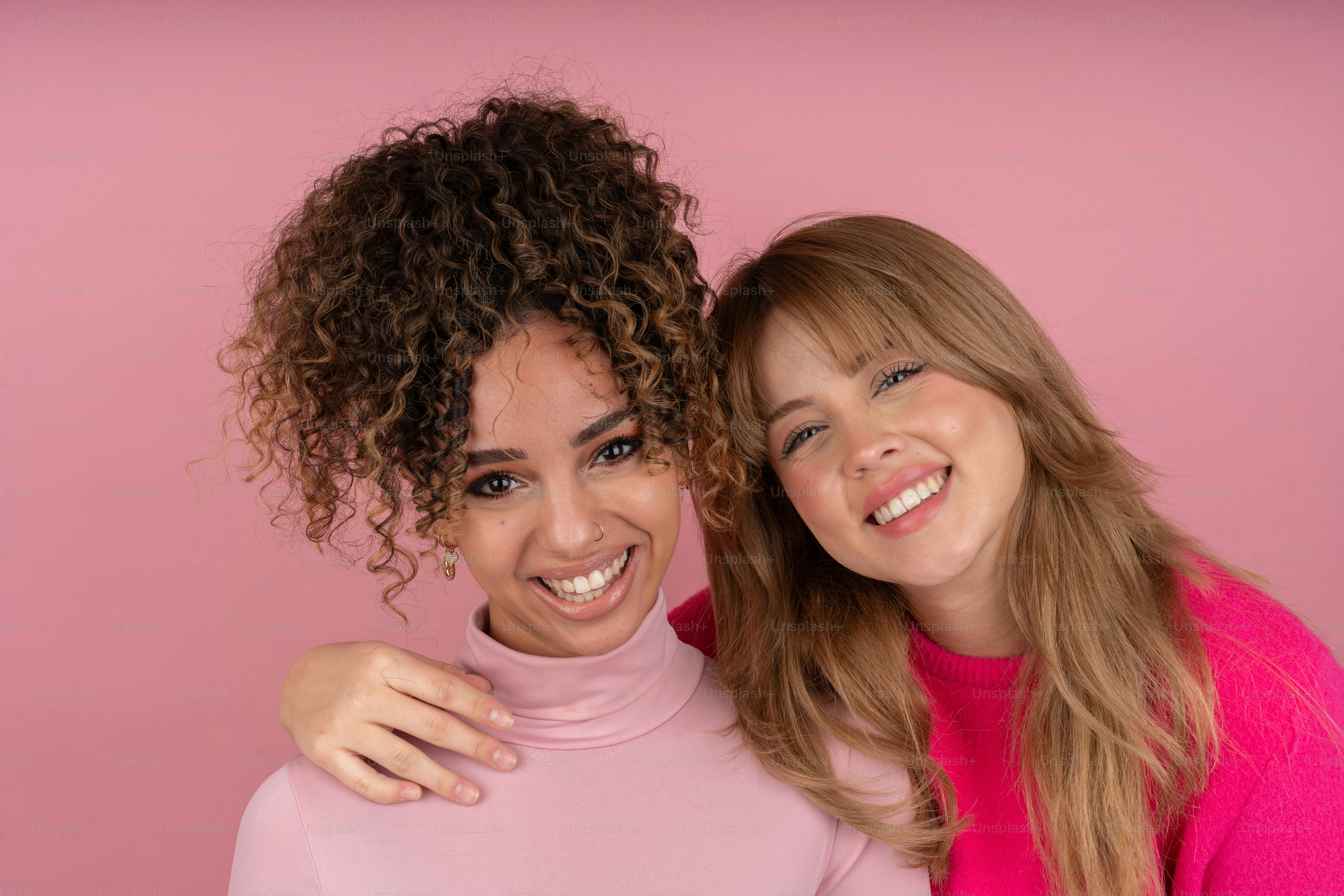 Two beautiful young women standing next to each other photo – Woman ...