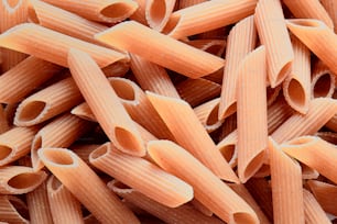a pile of uncooked and uncooked pasta