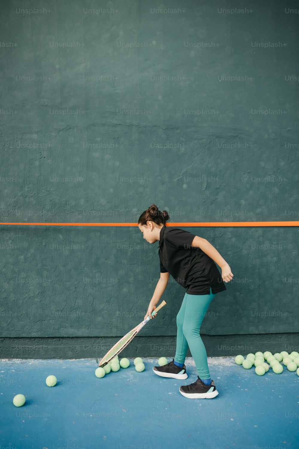 a woman is playing tennis on a court