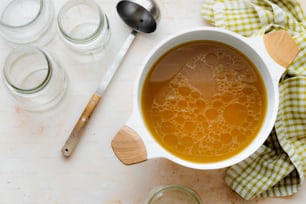 a bowl of soup with a spoon next to it