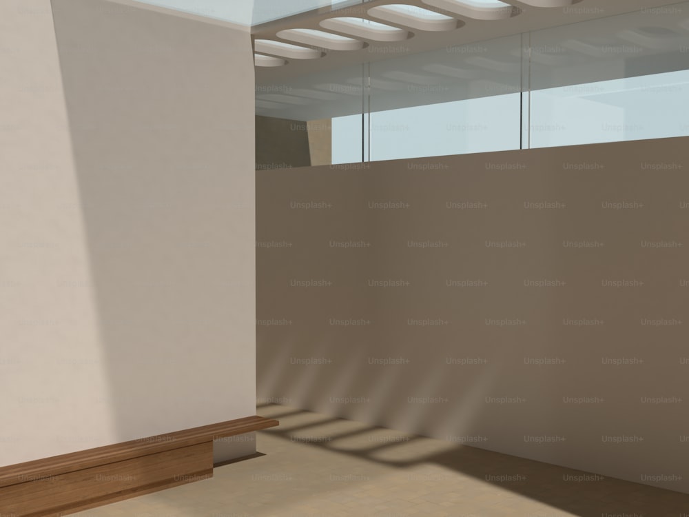 una stanza con pavimento in legno e parete bianca