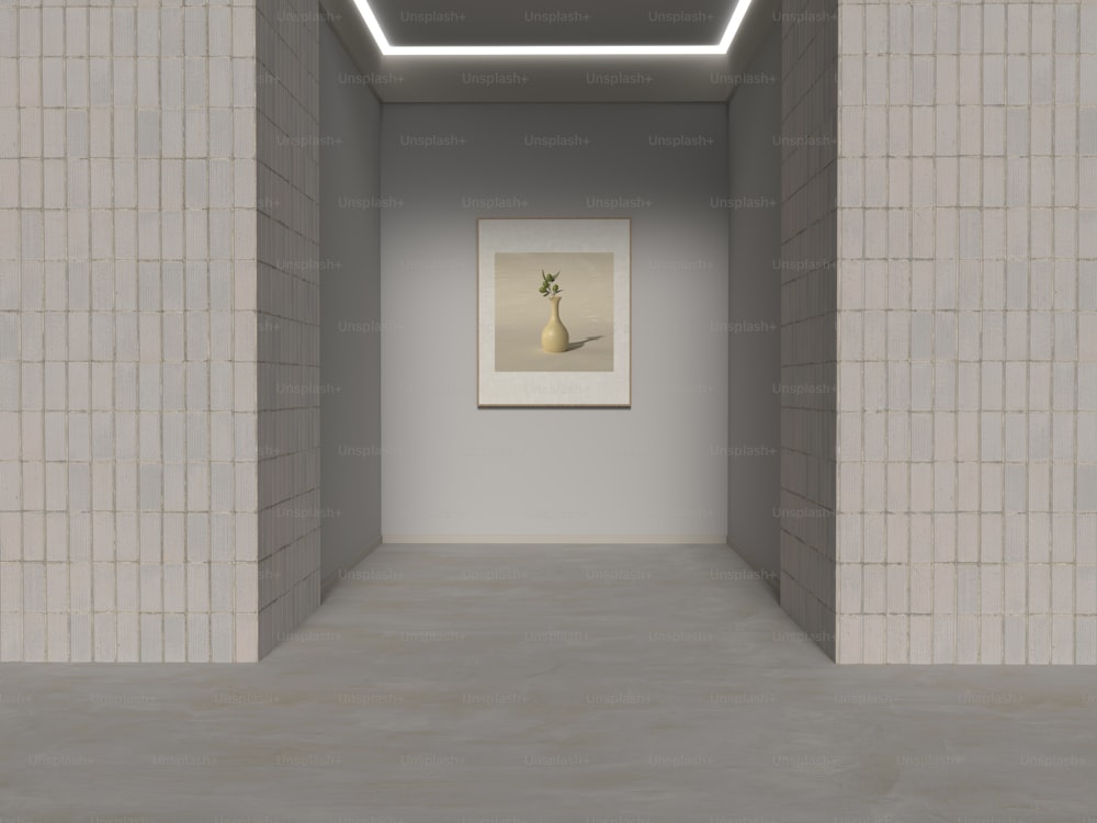 an empty room with a painting on the wall