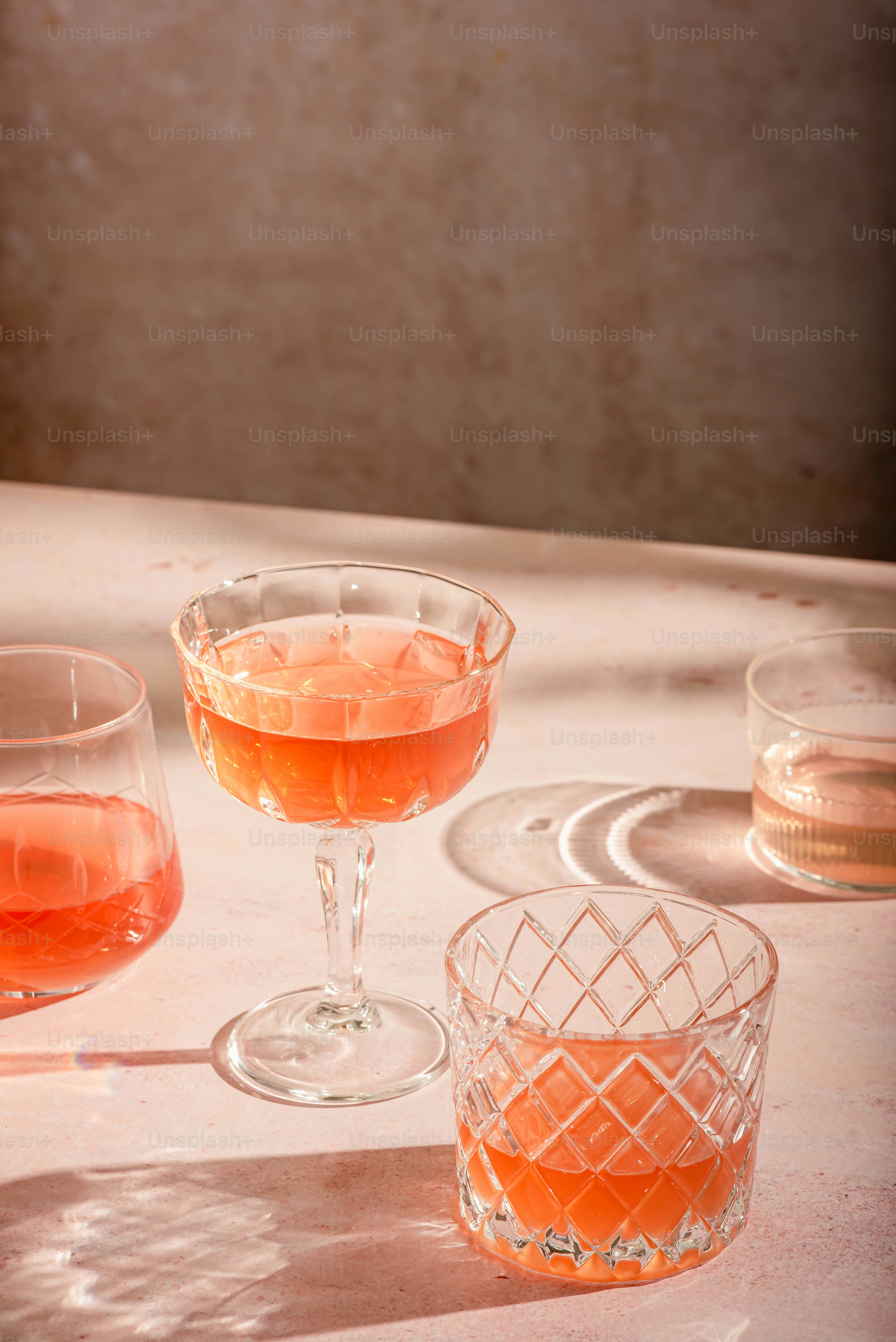 three glasses of wine sitting on a table