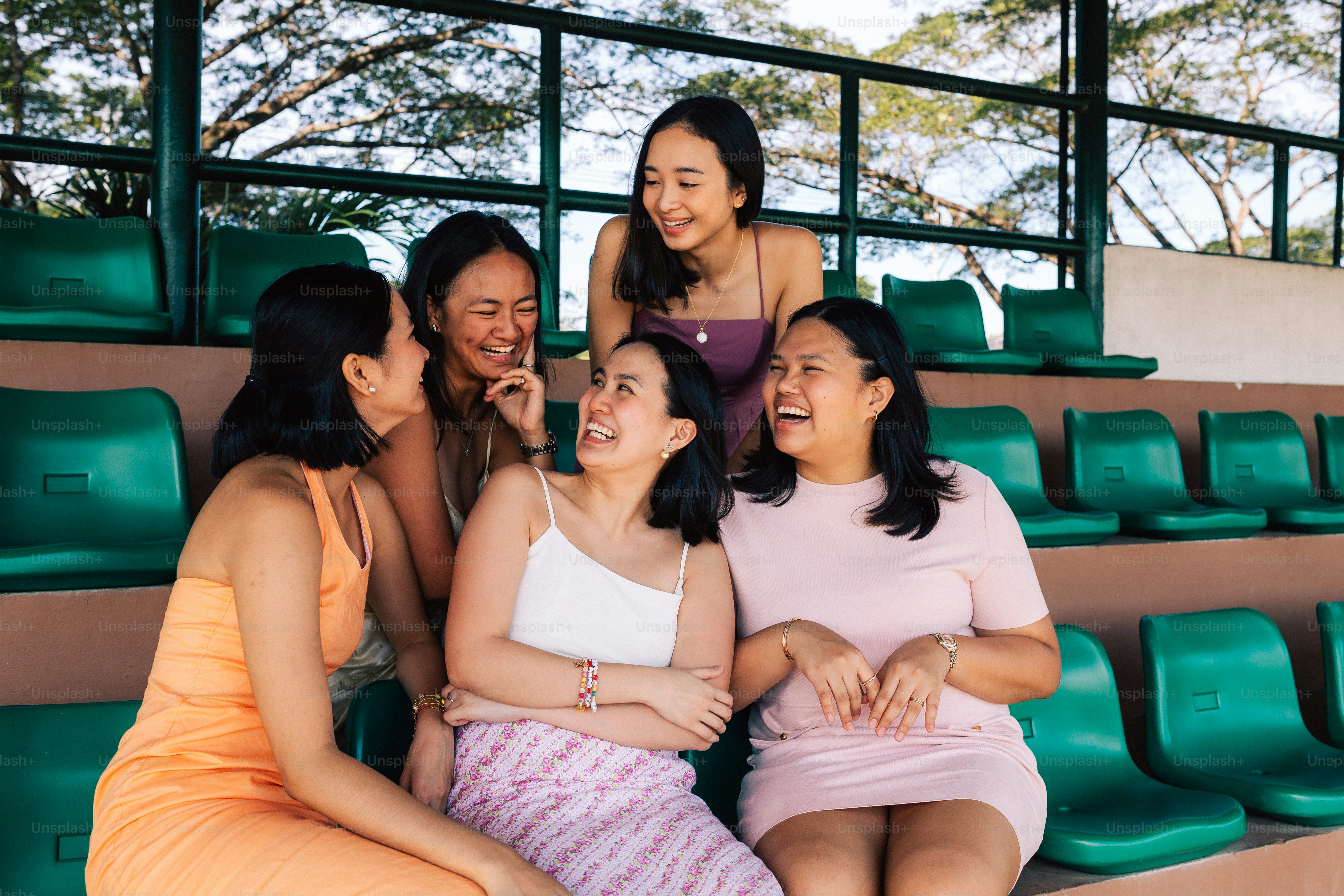 a group of women sitting next to each other