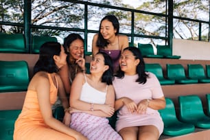 a group of women sitting next to each other