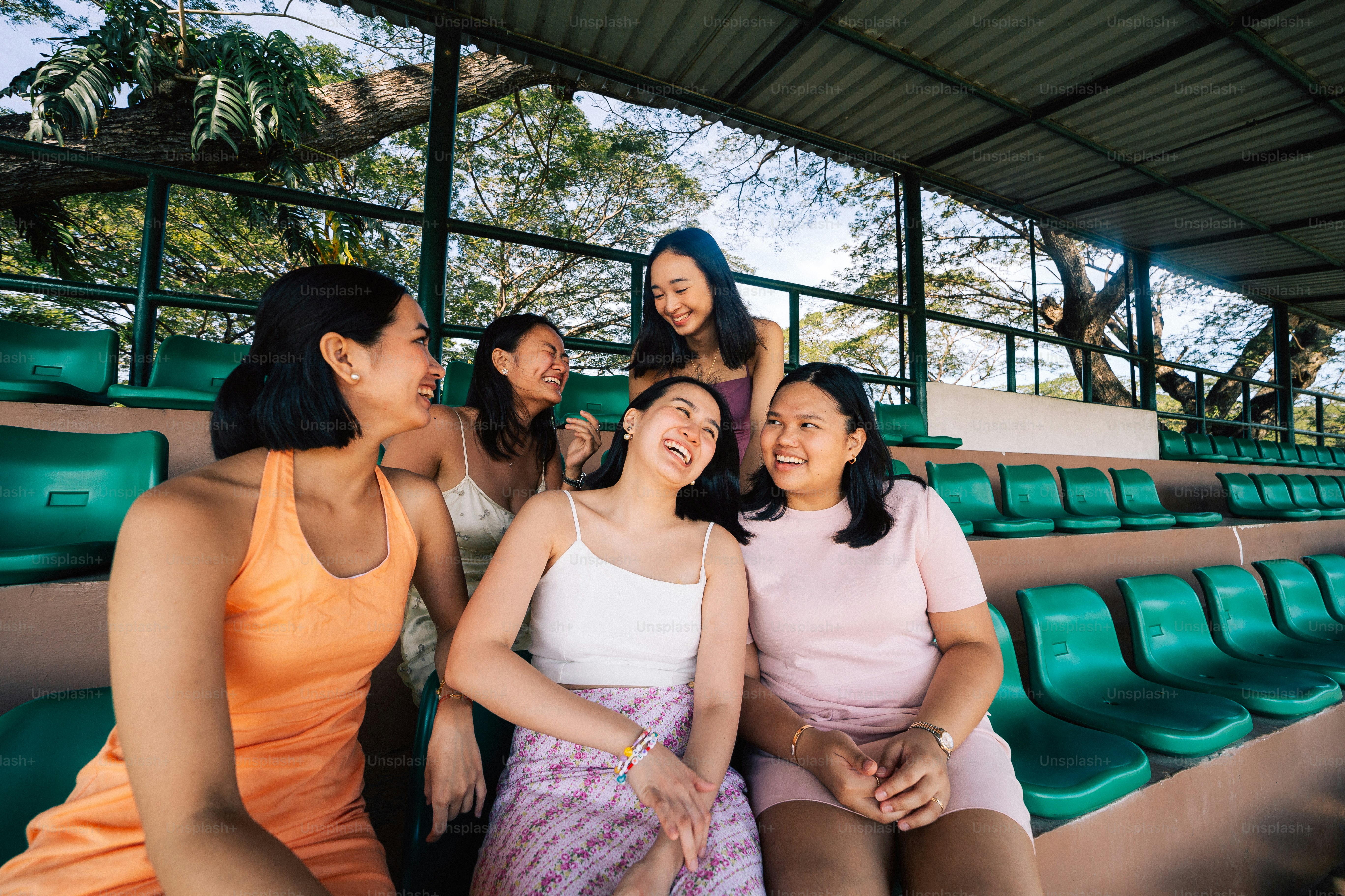 a group of women sitting next to each other
