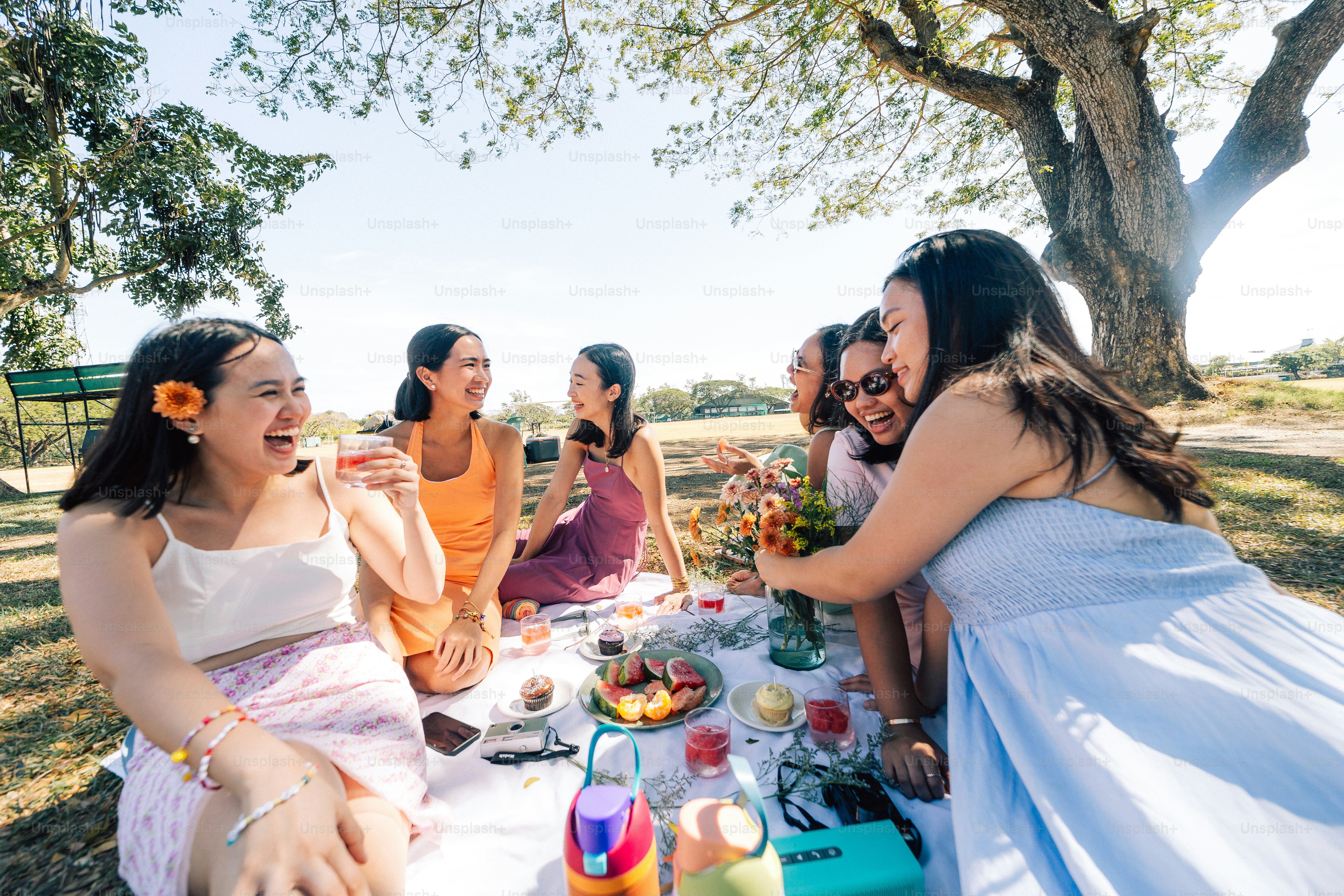 a group of women sitting around a table