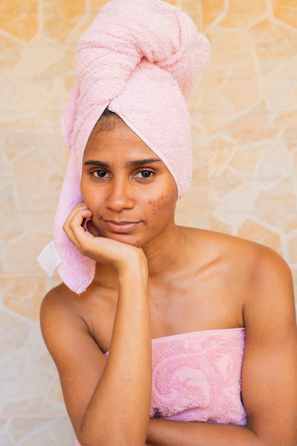 a woman with a towel wrapped around her head