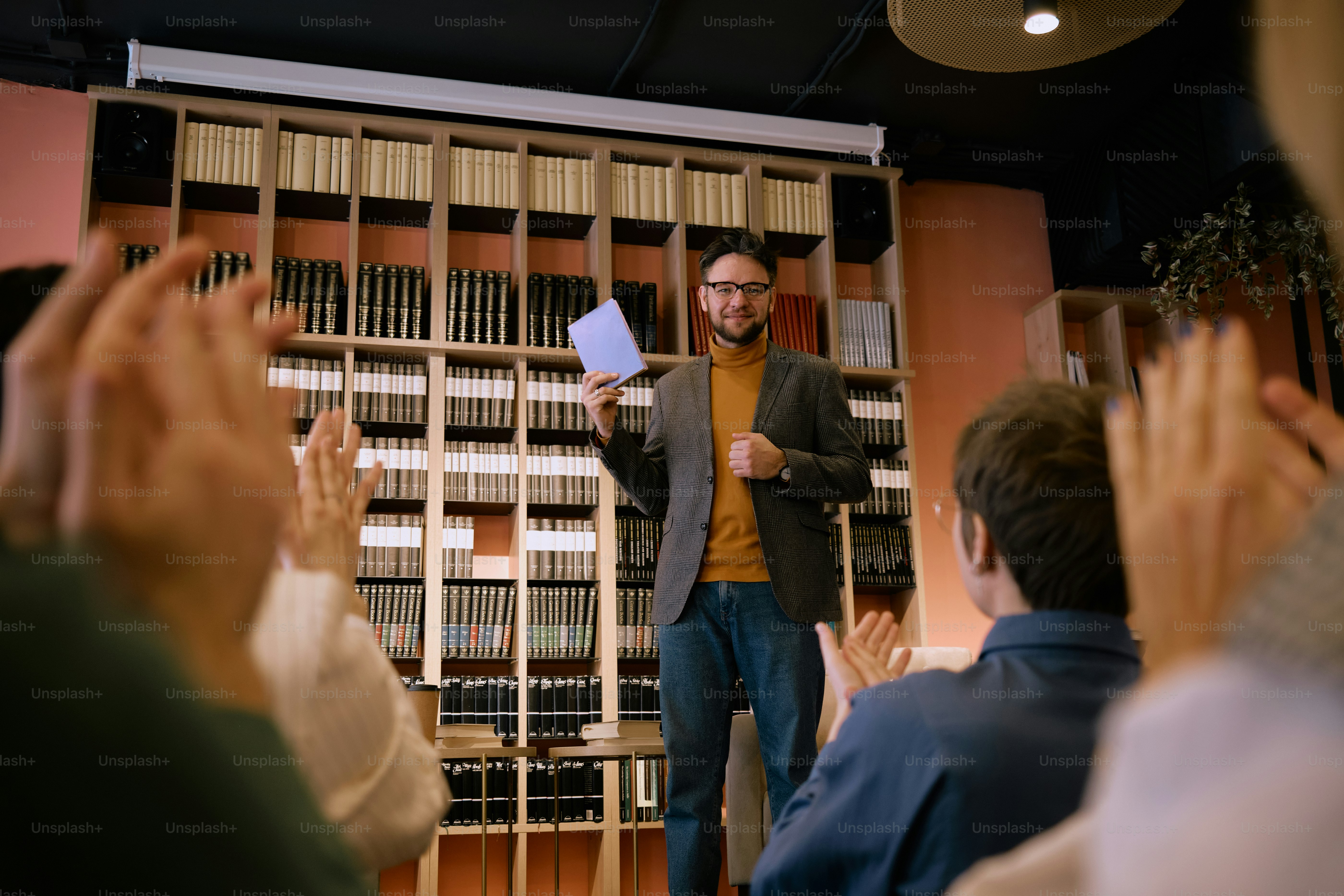 a man standing in front of a group of people