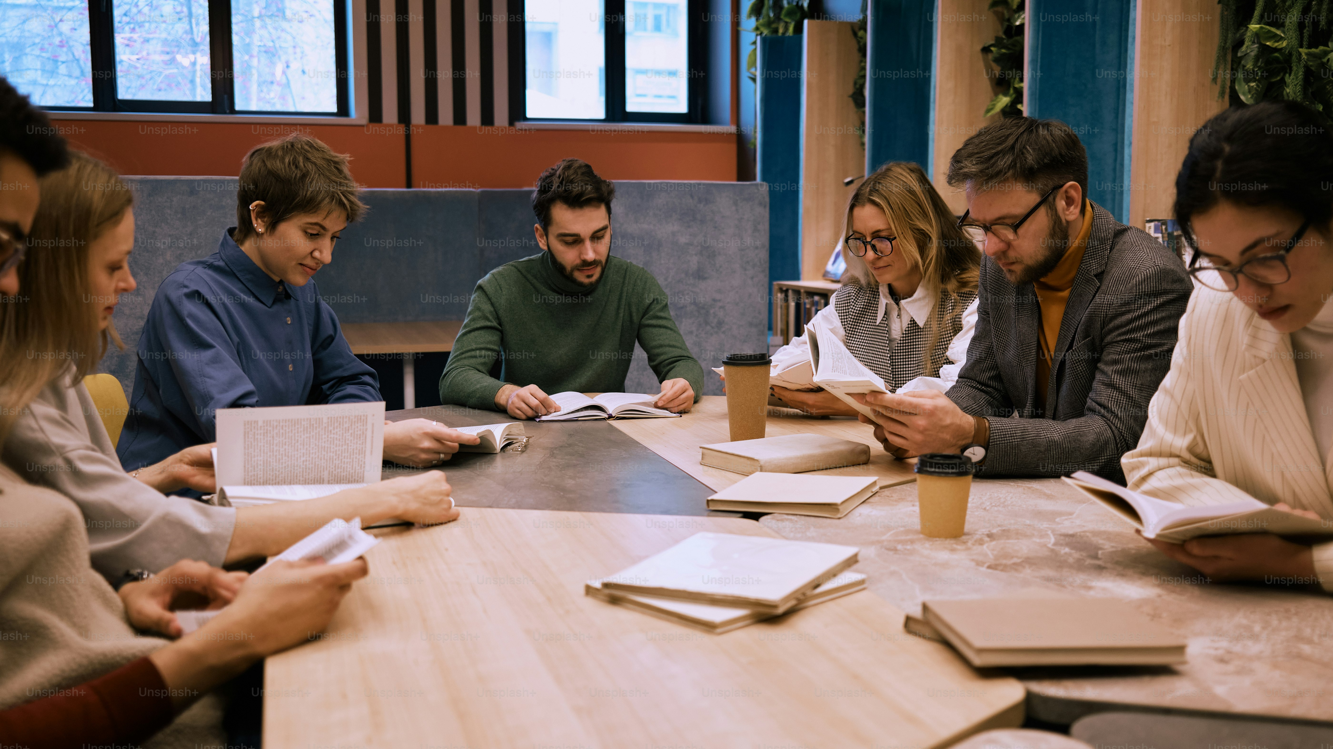 Team reviewing multilingual contracts and reports in an office