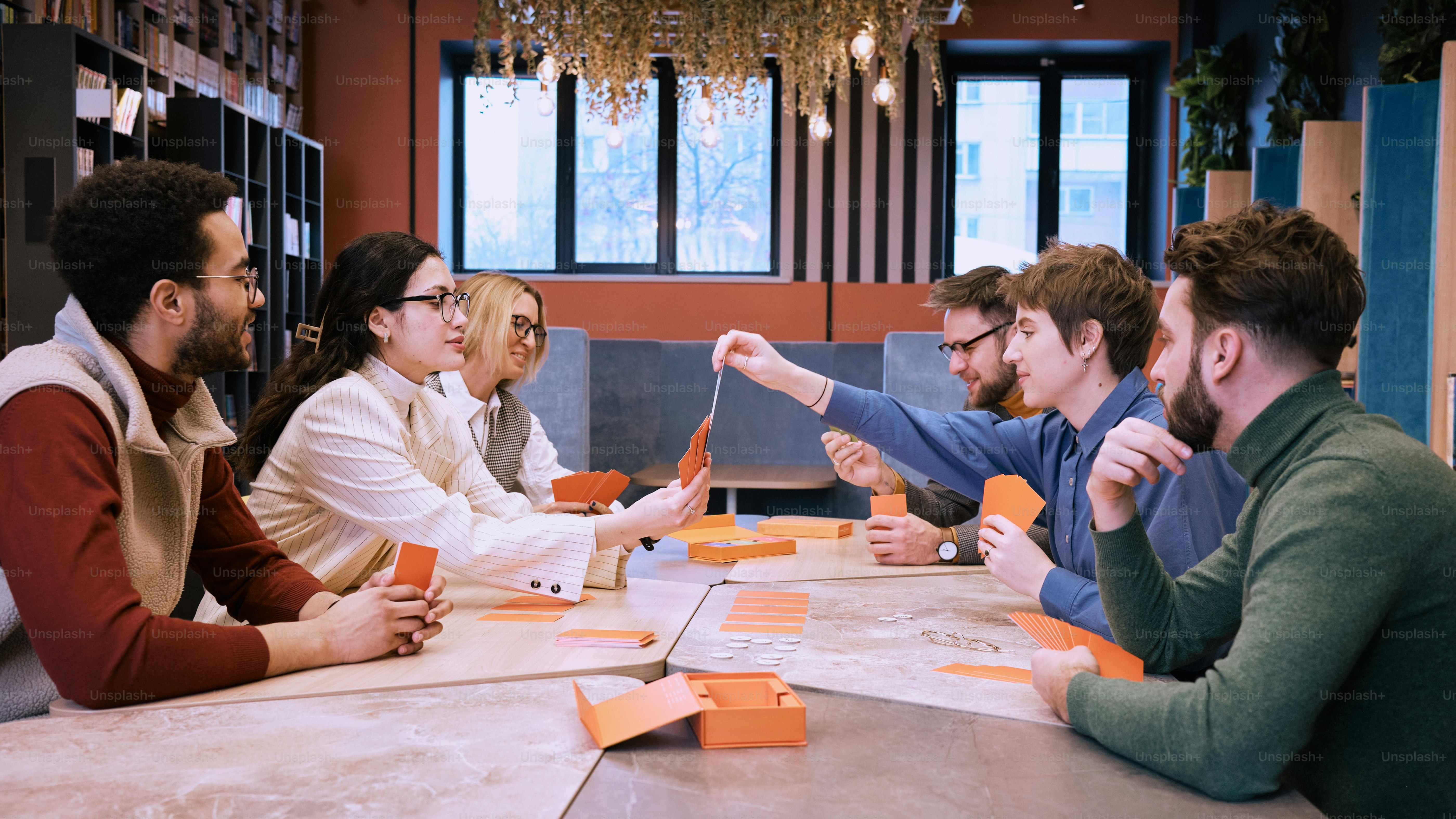 a group of people sitting around a table