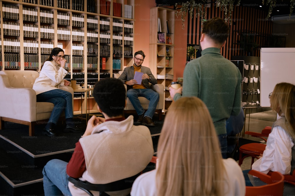 a group of people sitting around a room