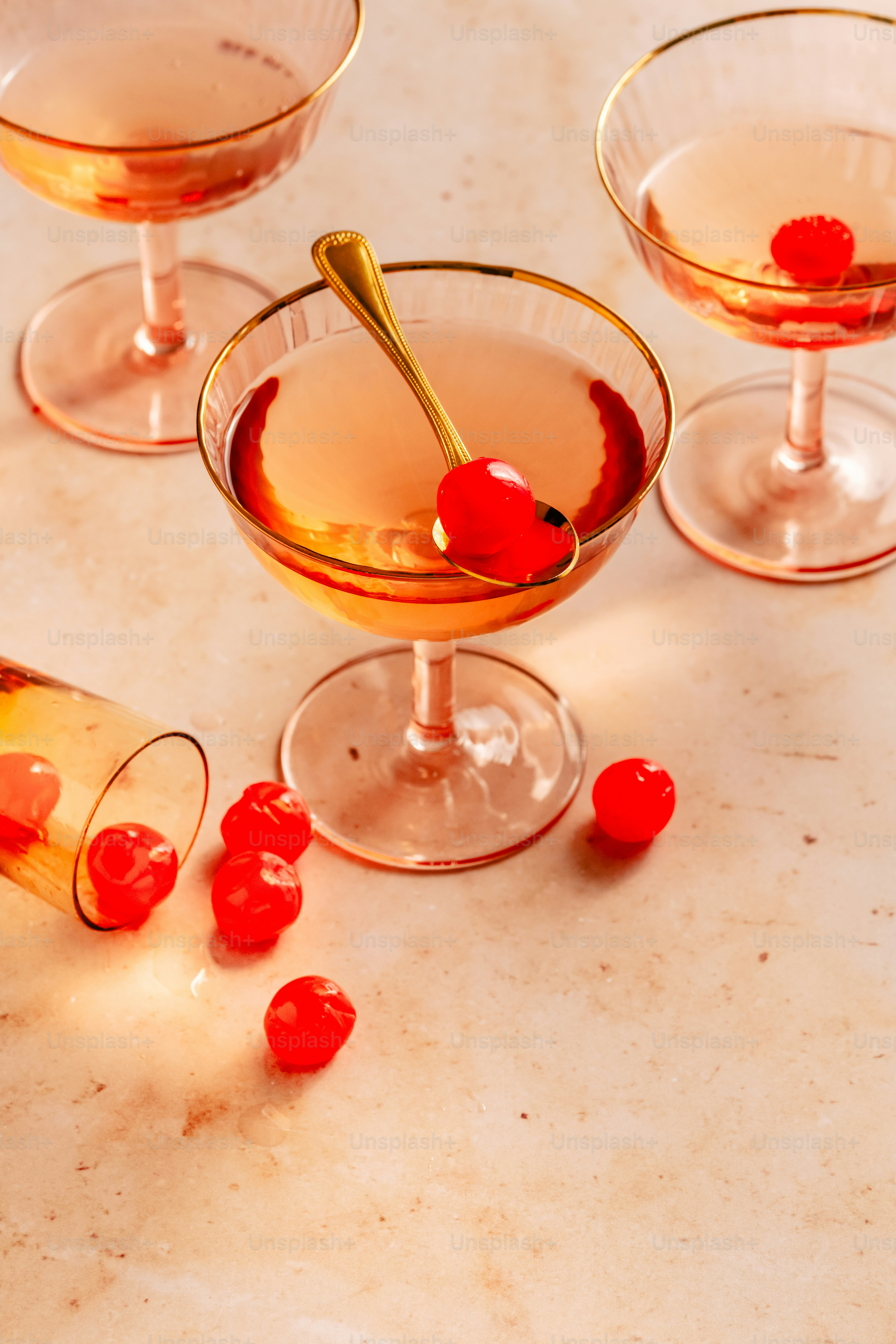 a table topped with wine glasses filled with drinks