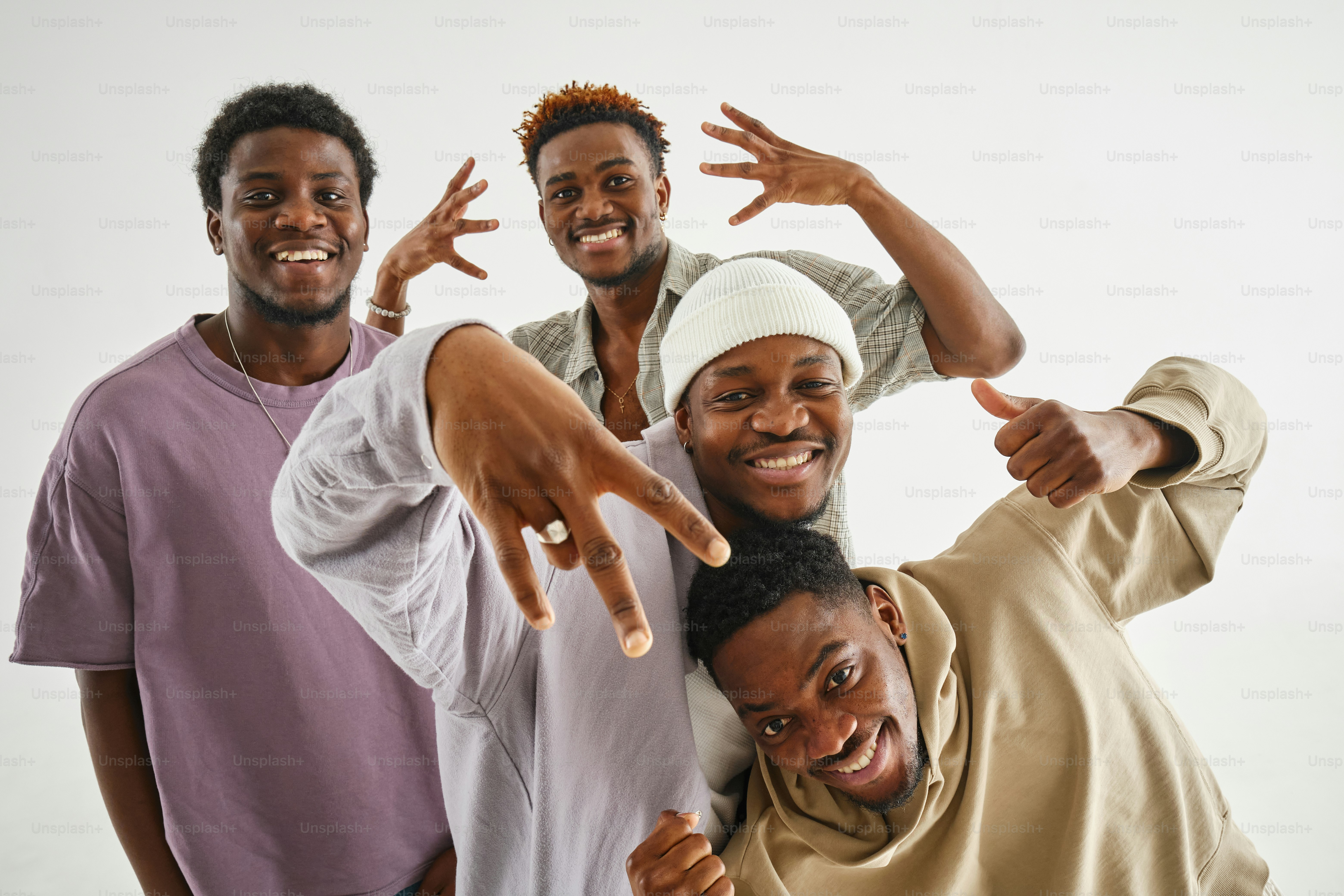 modern group of of fashionably dressed dark-skinned men in a studio