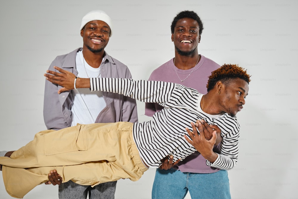 three men are posing for a picture together