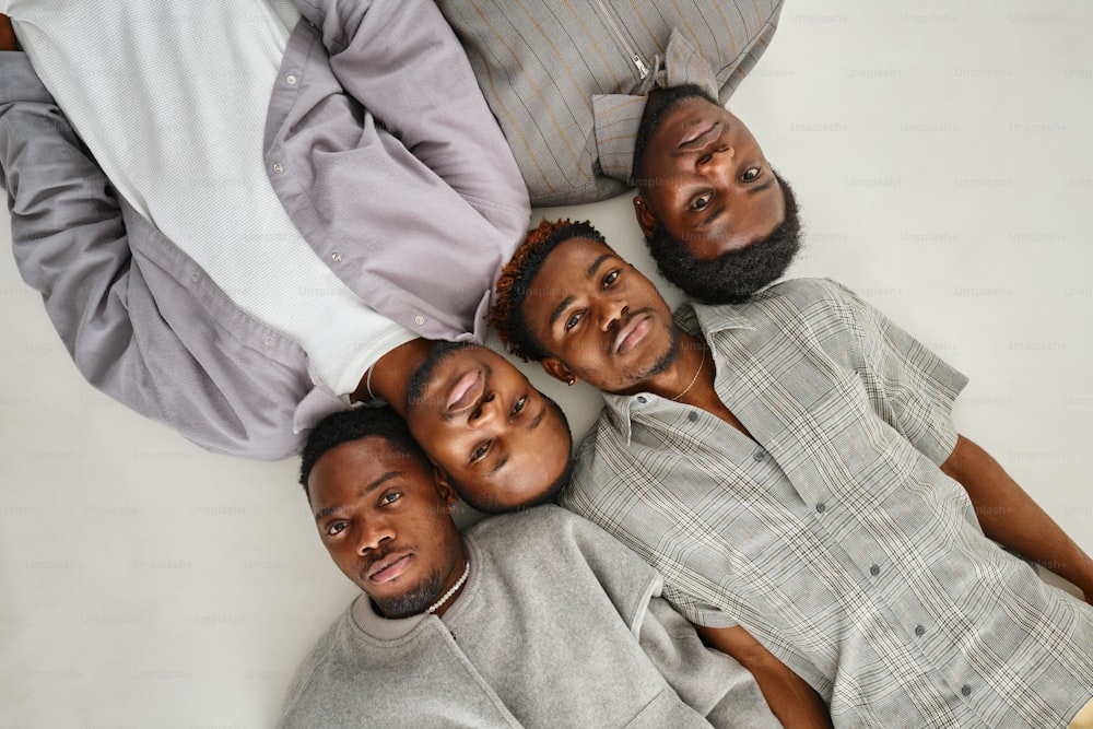 a group of men laying on top of each other