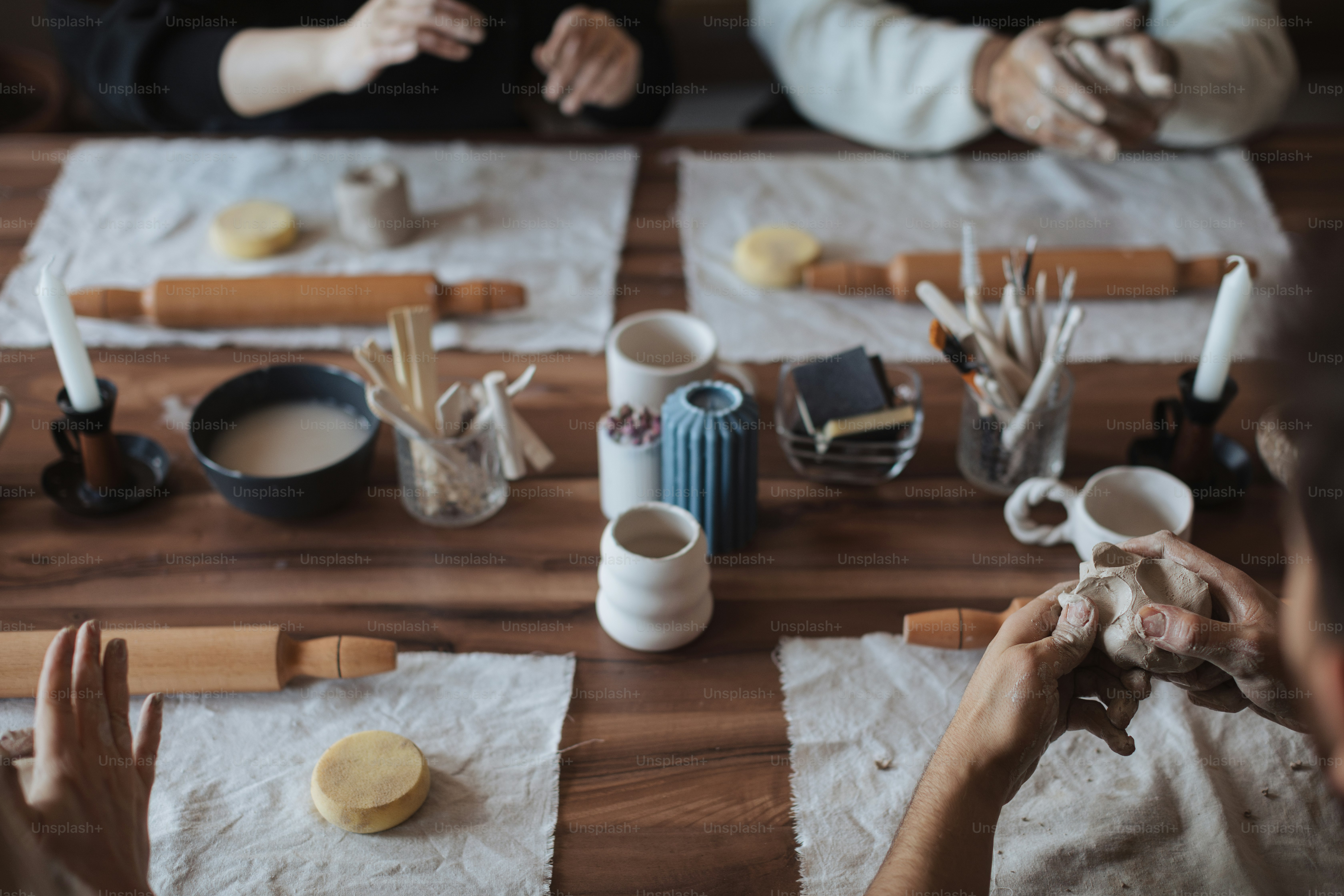 a group of people sitting around a wooden table