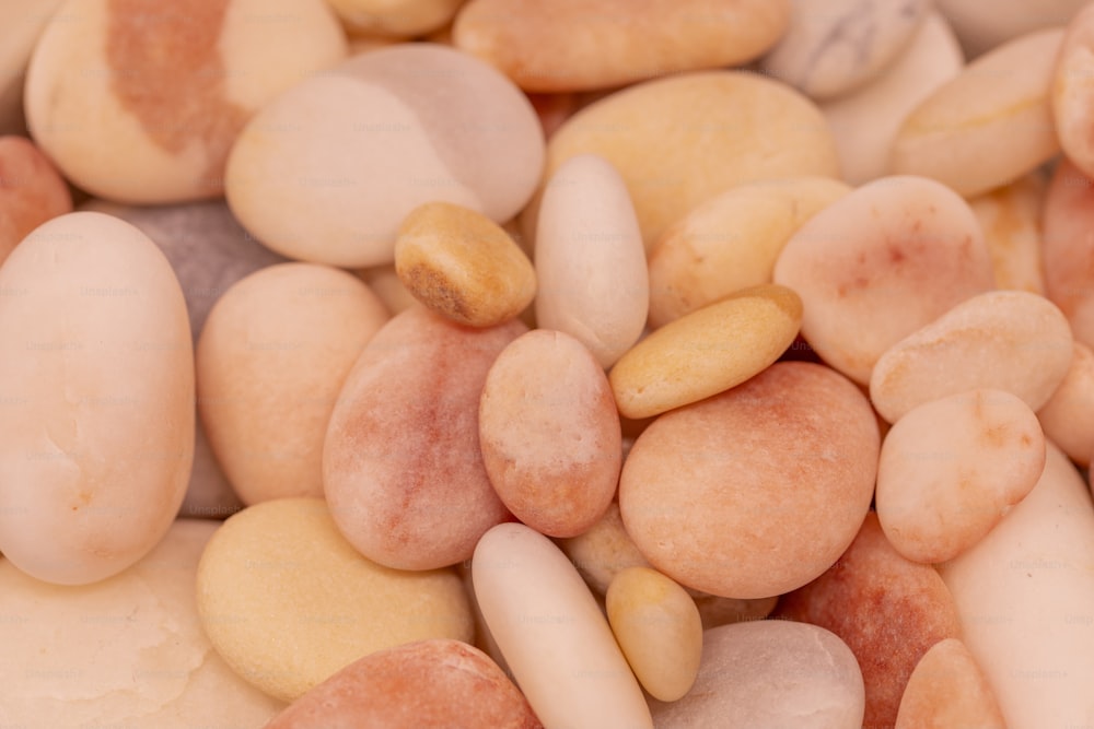 a close up of a bunch of different colored rocks