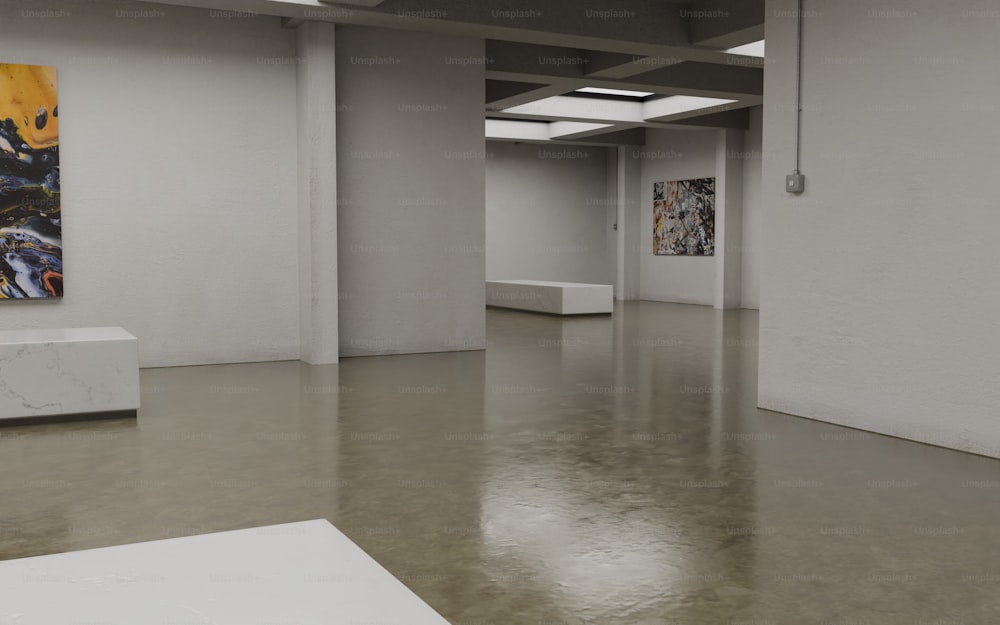 an empty room with paintings on the walls