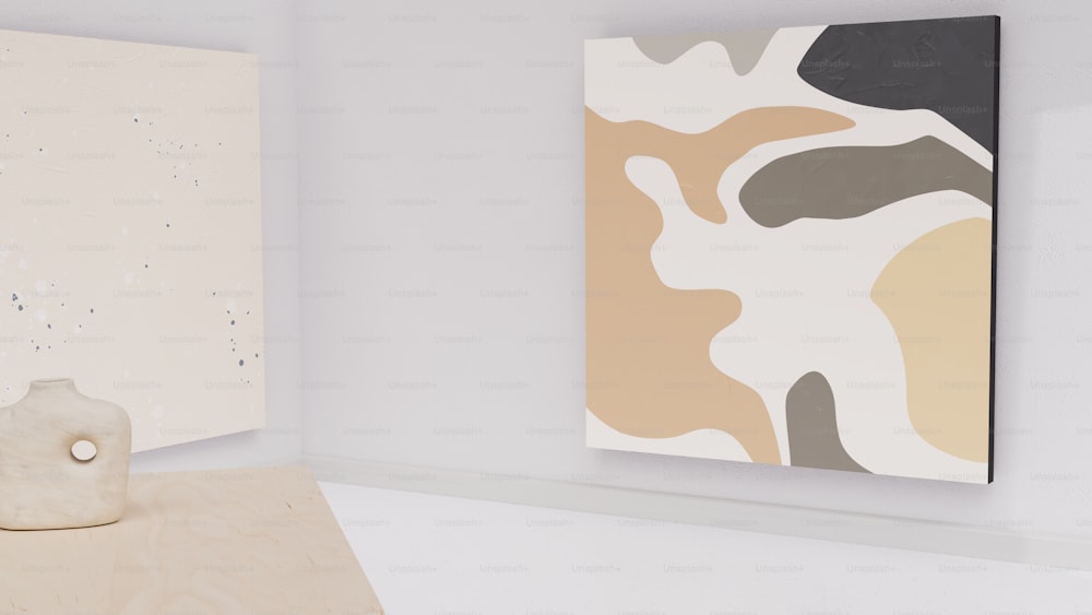 two paintings hang on a wall next to a wooden sculpture