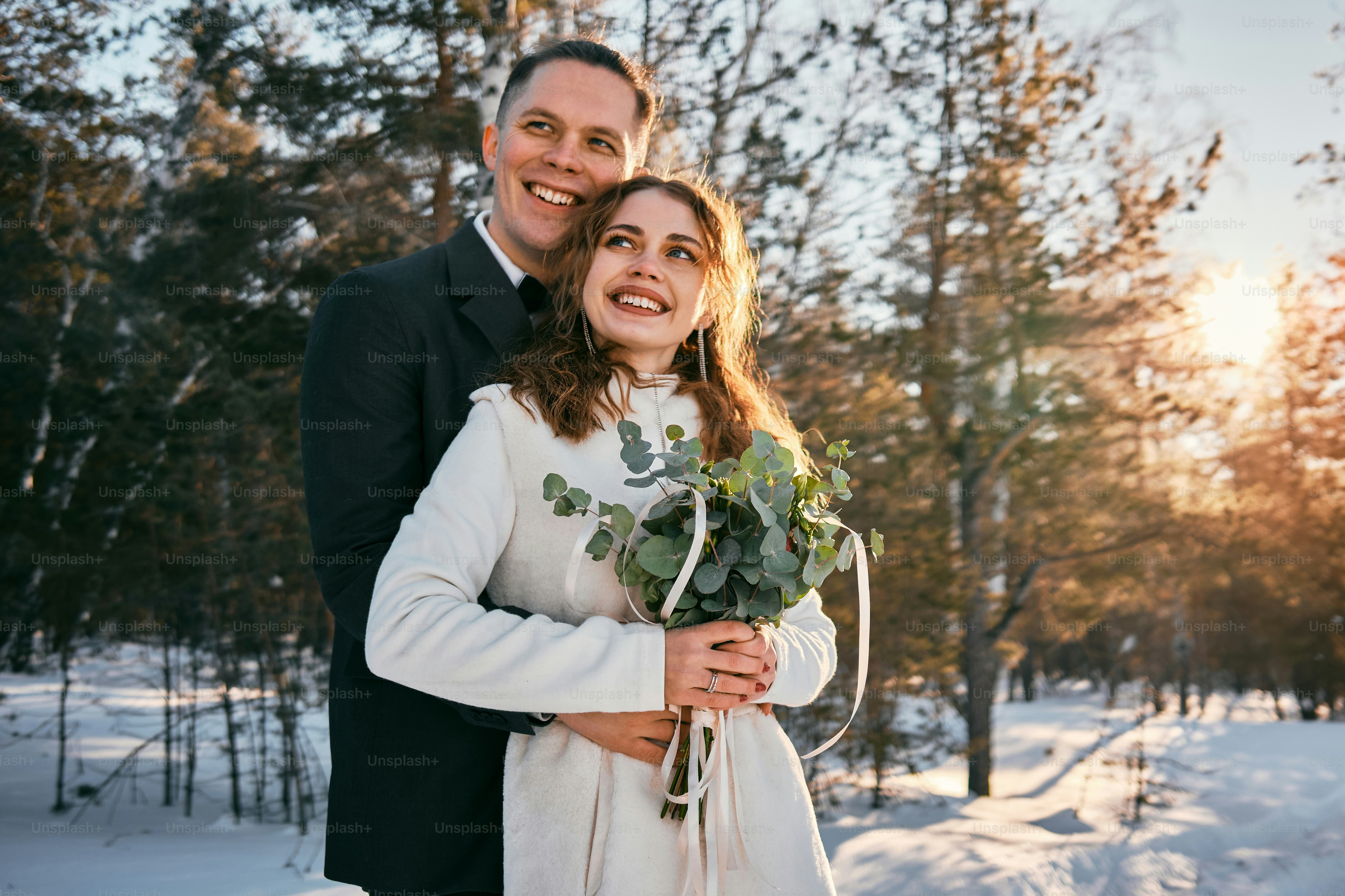 Couple holding a modern anniversary flower trends bouquet during celebration