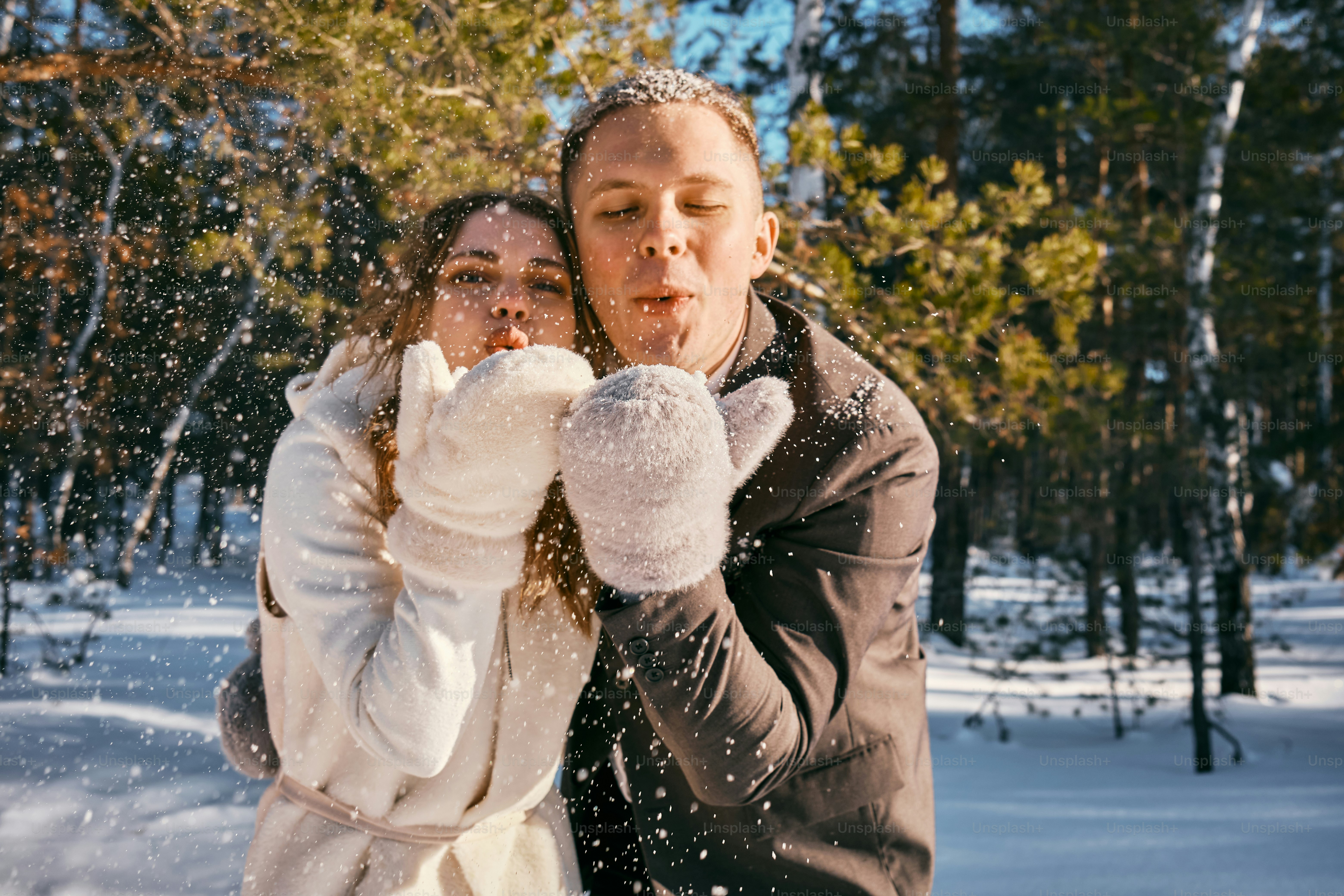 A man and a woman standing in the snow photo – Bride Image on Unsplash