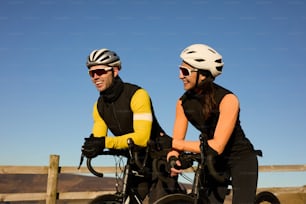 a man and a woman riding bikes together