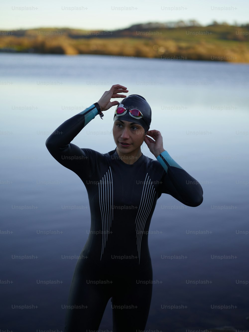 a woman wearing a wet suit and goggles