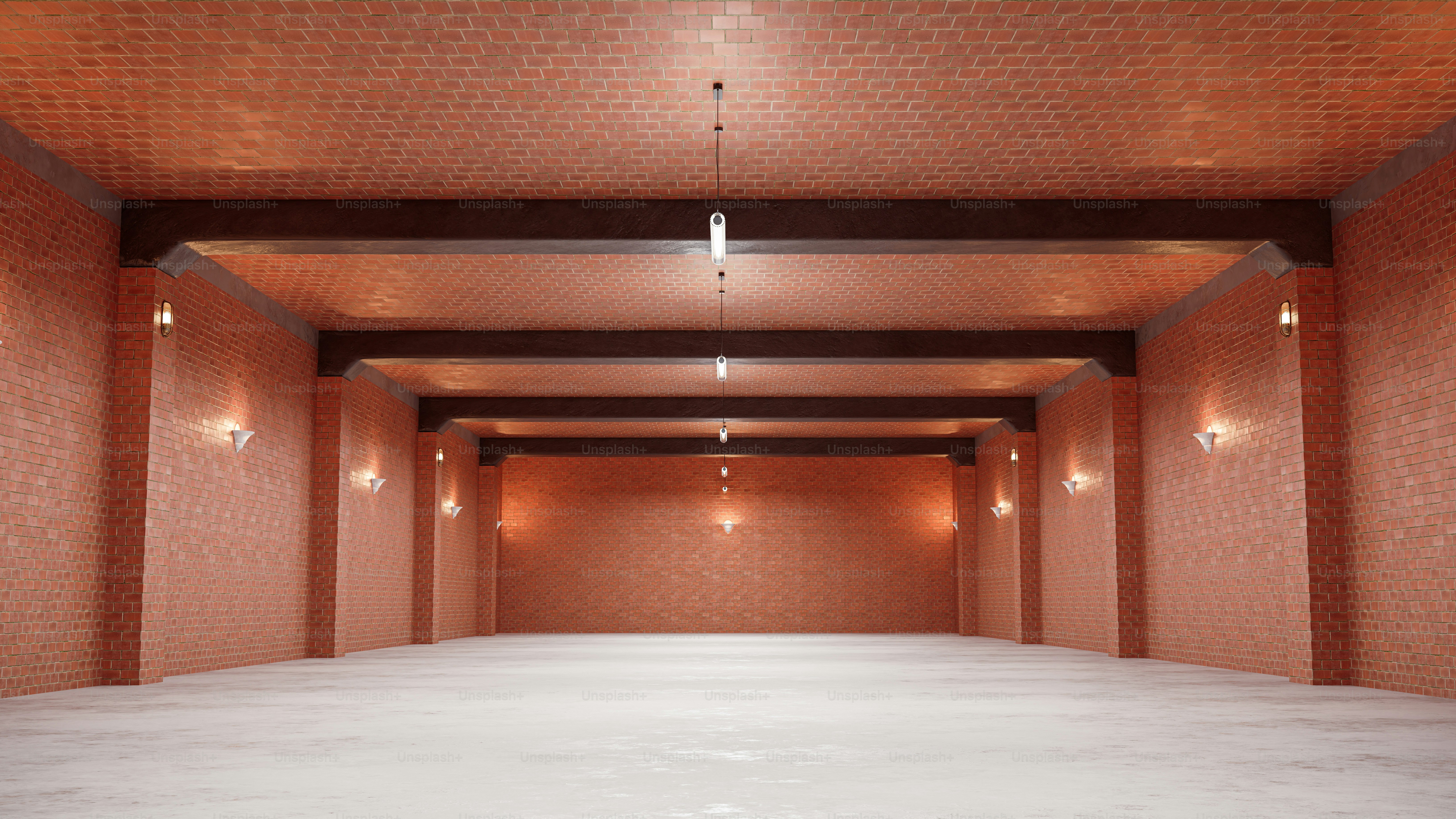 Une pièce vide avec des murs en briques rouges et des lumières